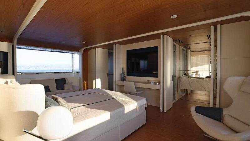 a room with a bed and a tv aboard KOJU Yacht for Sale