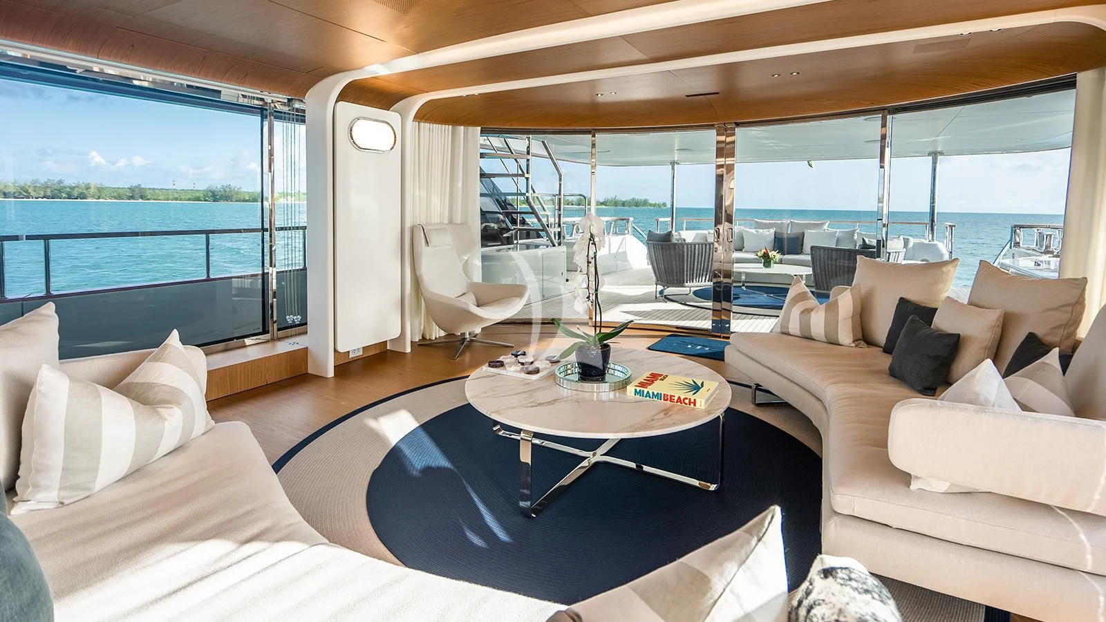 a living room with a large window aboard KOJU Yacht for Sale