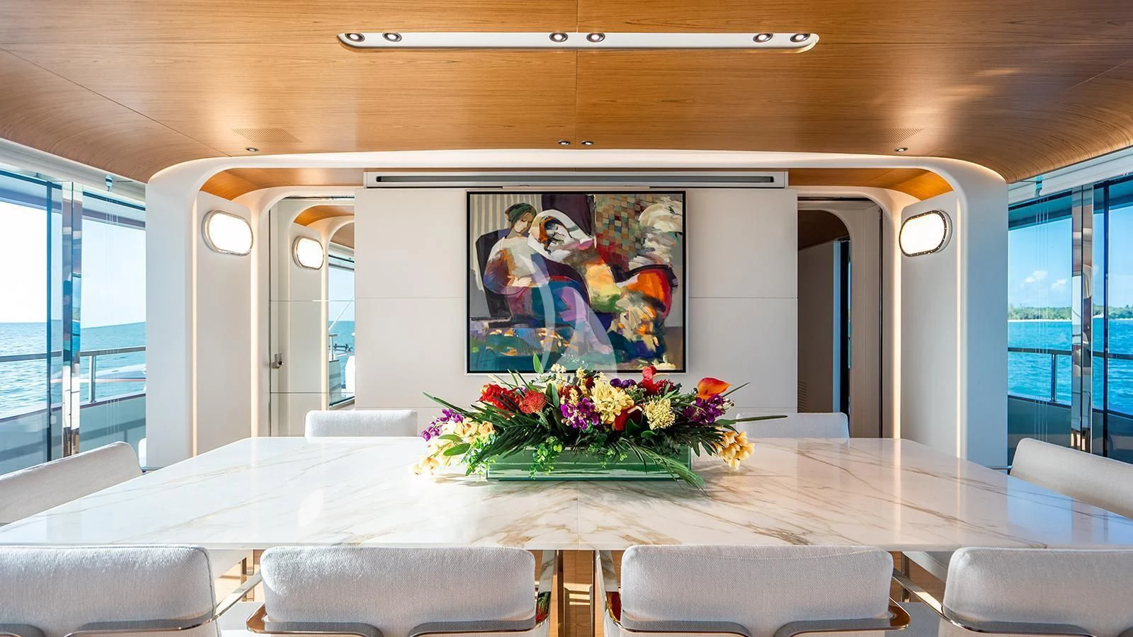 a large screen in a room aboard KOJU Yacht for Sale