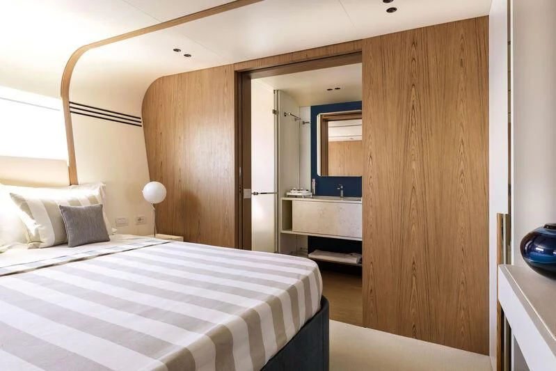 a bedroom with a bed aboard KOJU Yacht for Sale