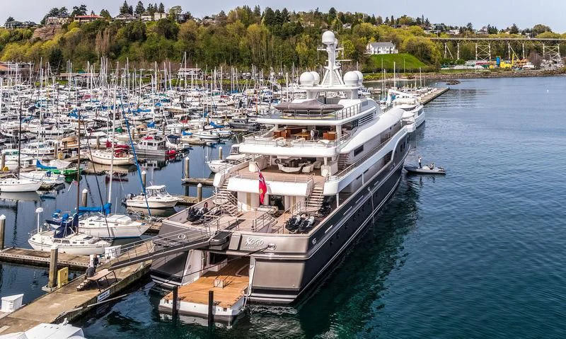 a large ship docked at a pier aboard KOJU Yacht for Sale