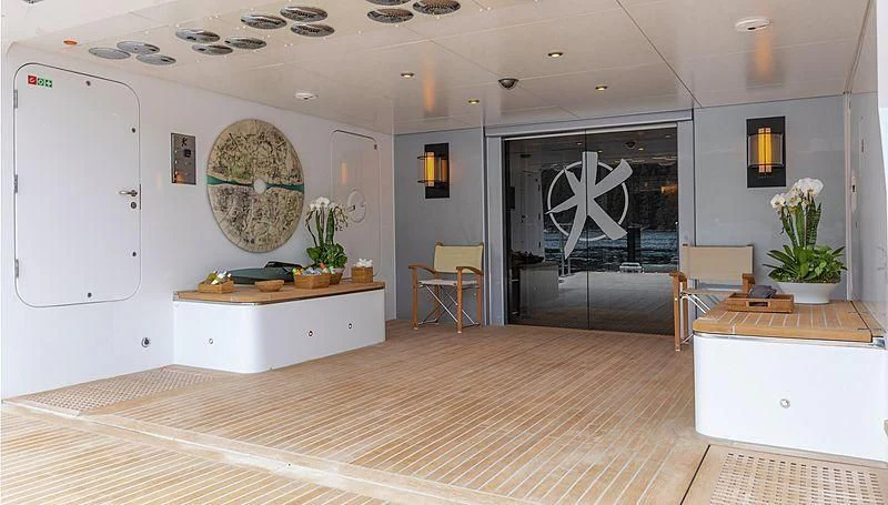 a room with a table and chairs aboard KOJU Yacht for Sale