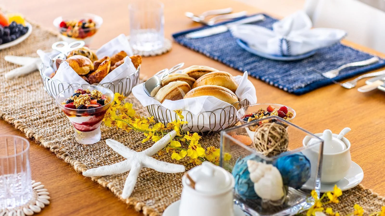 a table with food and drinks aboard KOJU Yacht for Sale