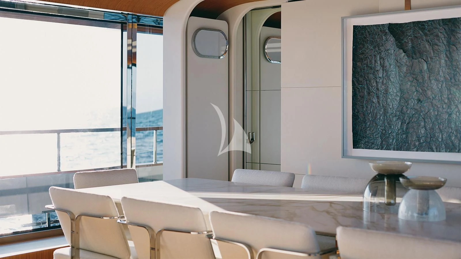 a room with a large window and a table with chairs aboard KOJU Yacht for Sale