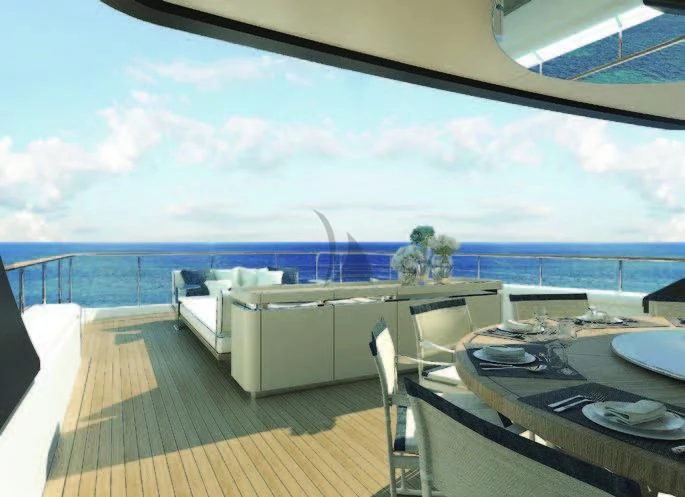 a deck with a large body of water and a large building with a balcony aboard KOJU Yacht for Sale