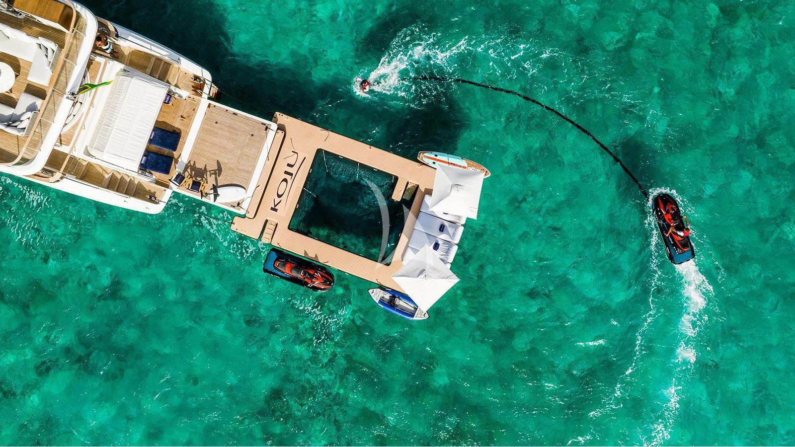 a helicopter flying over a house aboard KOJU Yacht for Sale