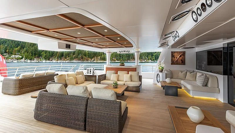 a living room with a large pool aboard KOJU Yacht for Sale