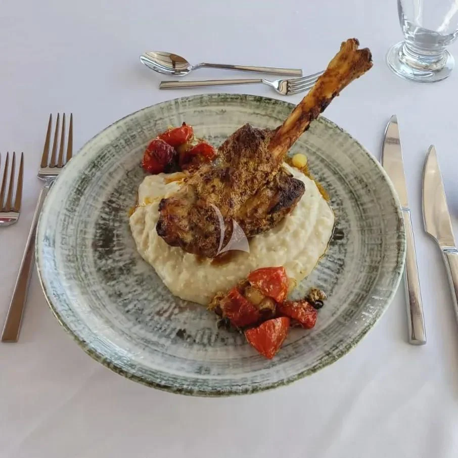 a plate of food aboard QUESTA VITA Yacht for Sale