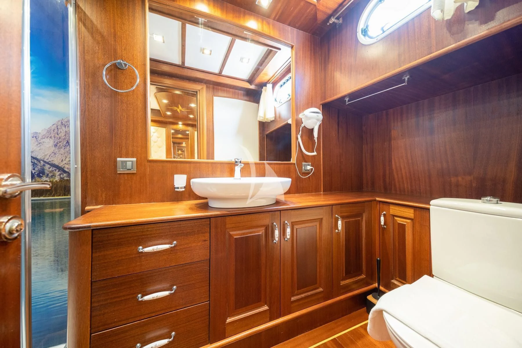 a bathroom with a sink and toilet aboard QUESTA VITA Yacht for Sale