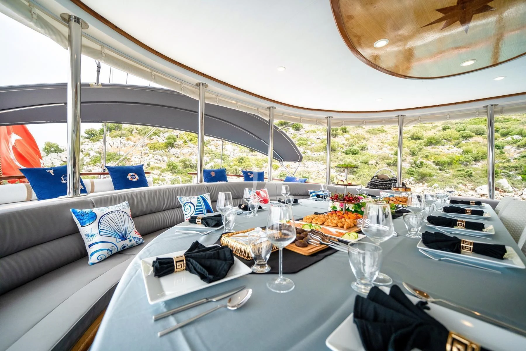 a table with food and drinks on it aboard QUESTA VITA Yacht for Sale