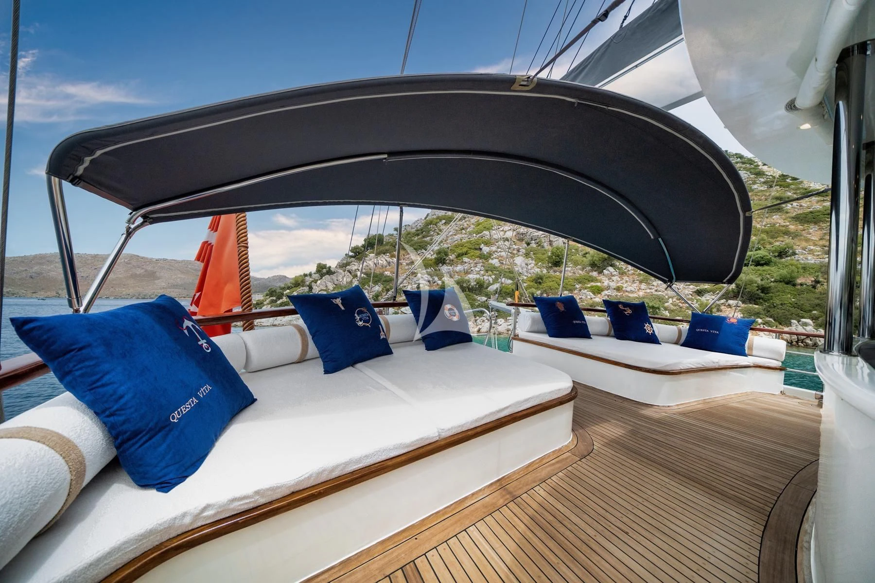 a tent with blue pillows aboard QUESTA VITA Yacht for Sale