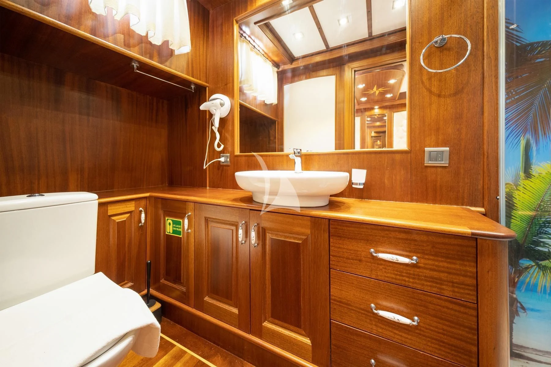 a bathroom with a sink and a toilet aboard QUESTA VITA Yacht for Sale