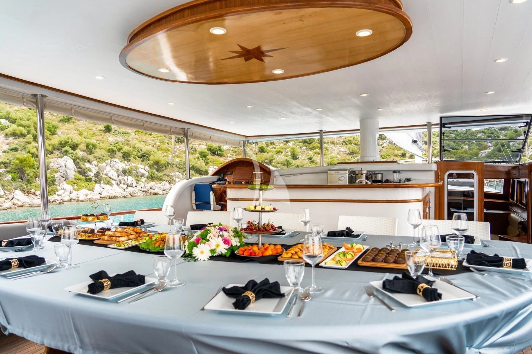 a table set for a dinner aboard QUESTA VITA Yacht for Sale