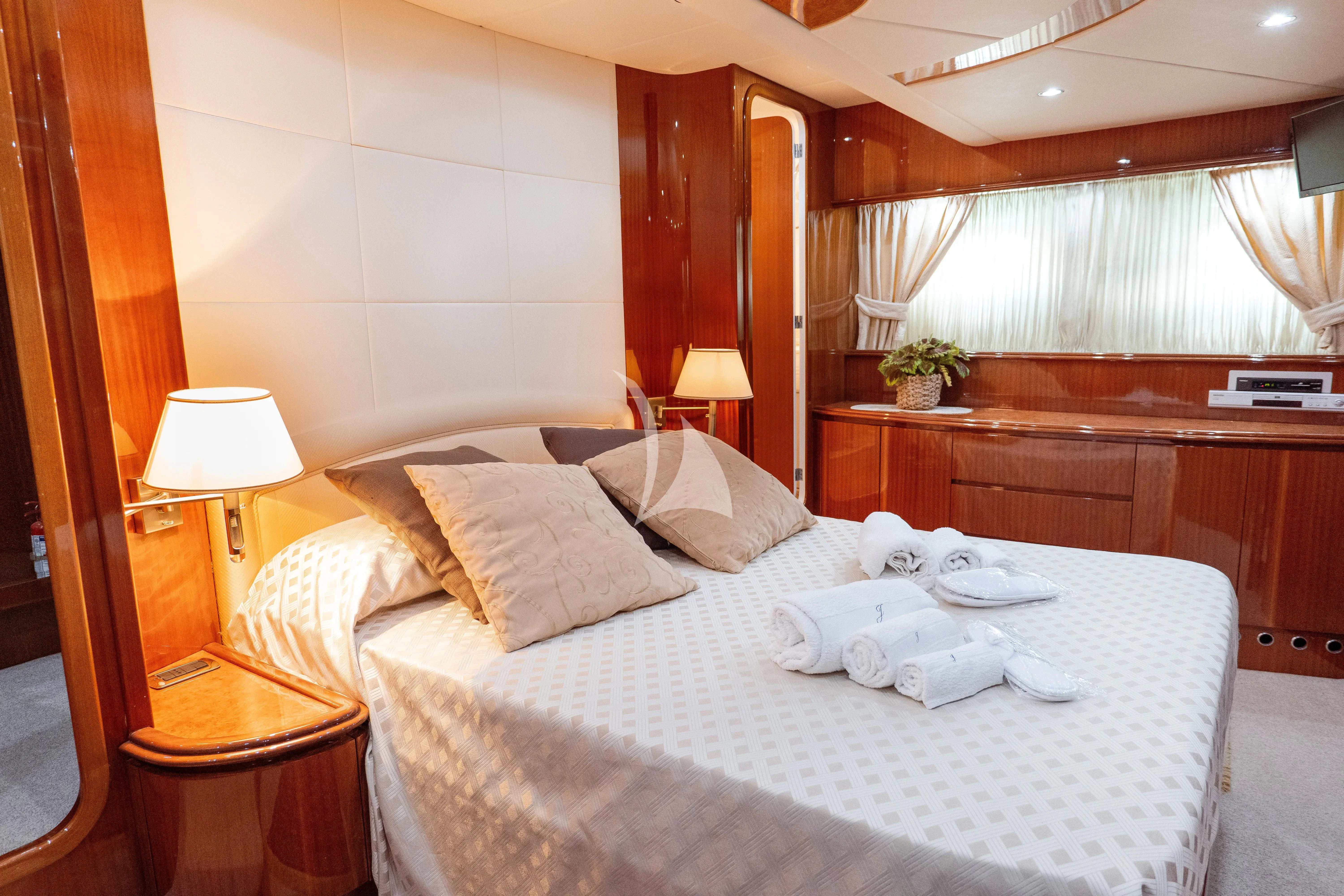 a hotel room with a bed aboard JAUNI Yacht for Sale