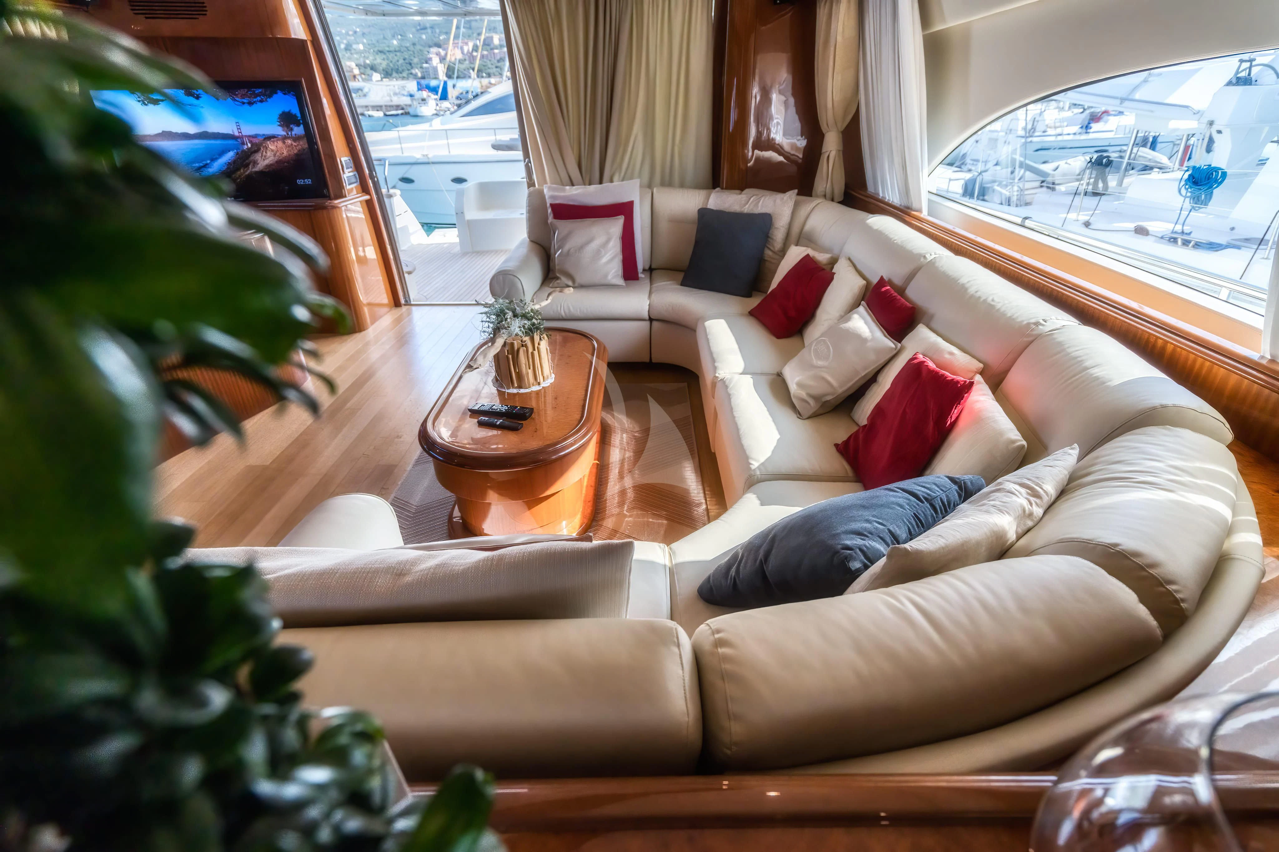 a living room with a couch and a table aboard JAUNI Yacht for Sale