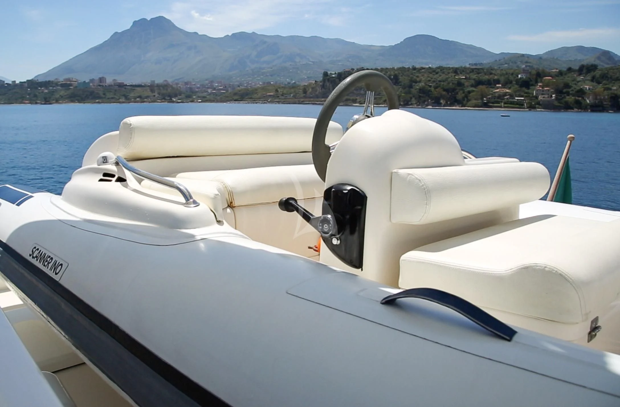 a white speedboat on the water aboard JAUNI Yacht for Sale