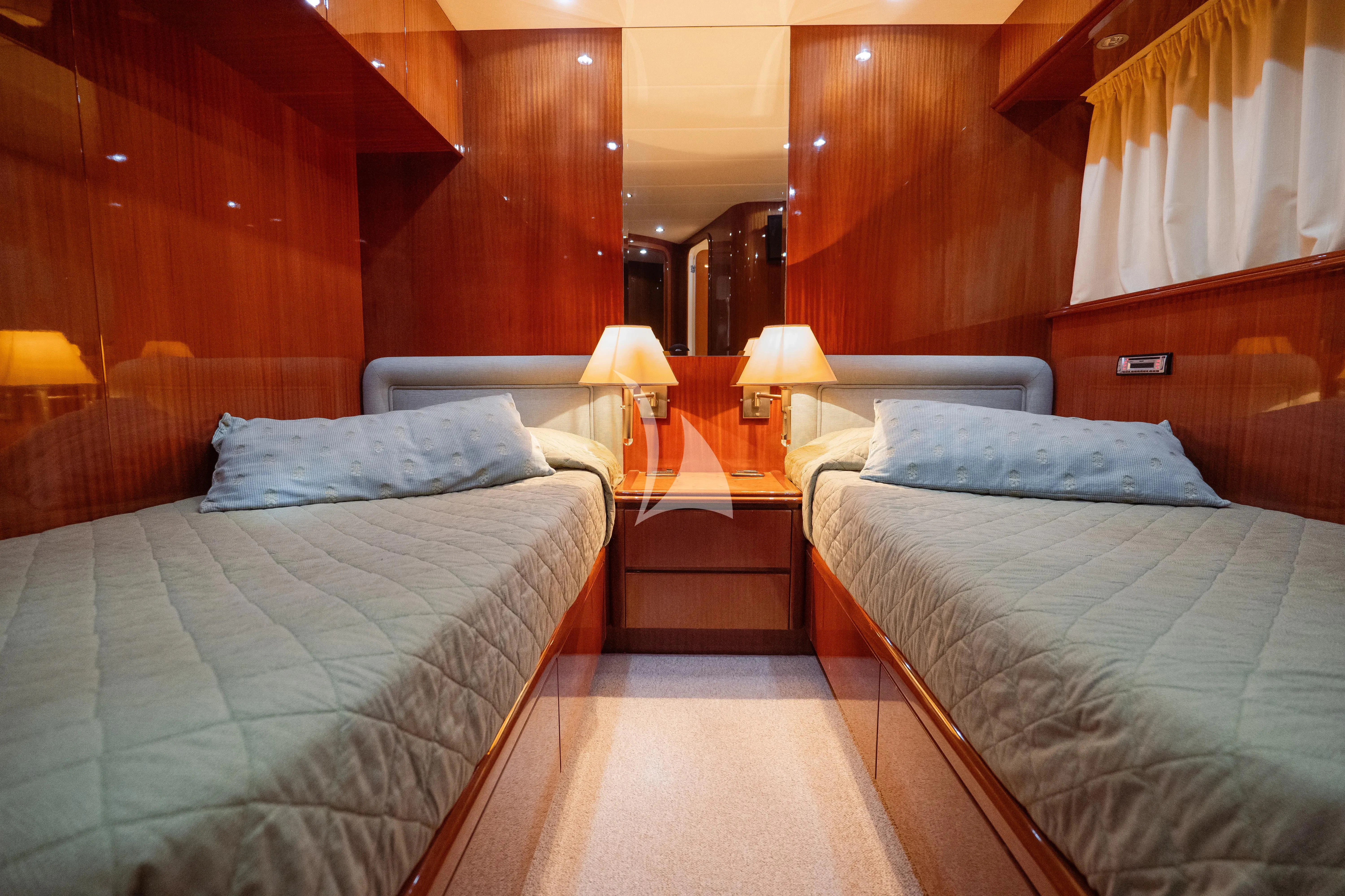 a couple of beds in a room aboard JAUNI Yacht for Sale
