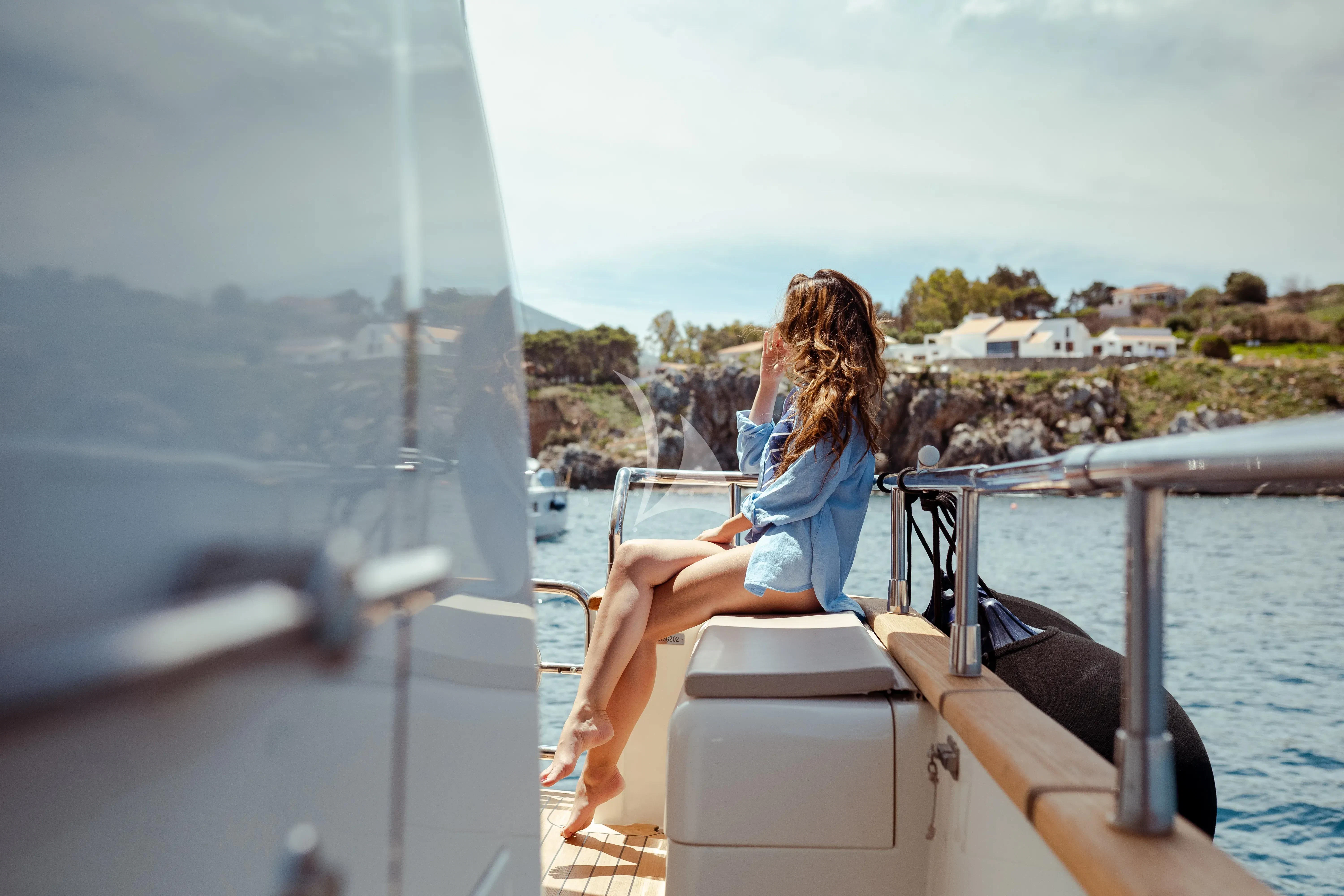 a person sitting on a boat aboard JAUNI Yacht for Sale