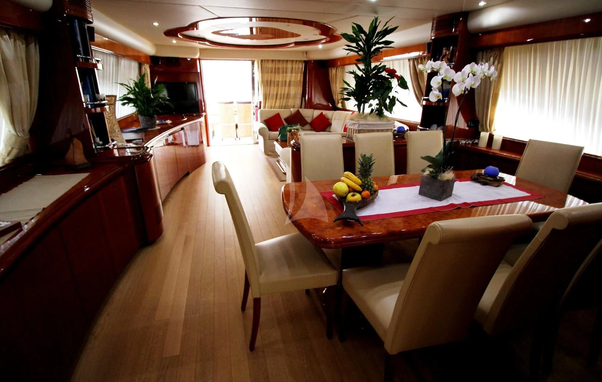 a room with a table and chairs aboard JAUNI Yacht for Sale