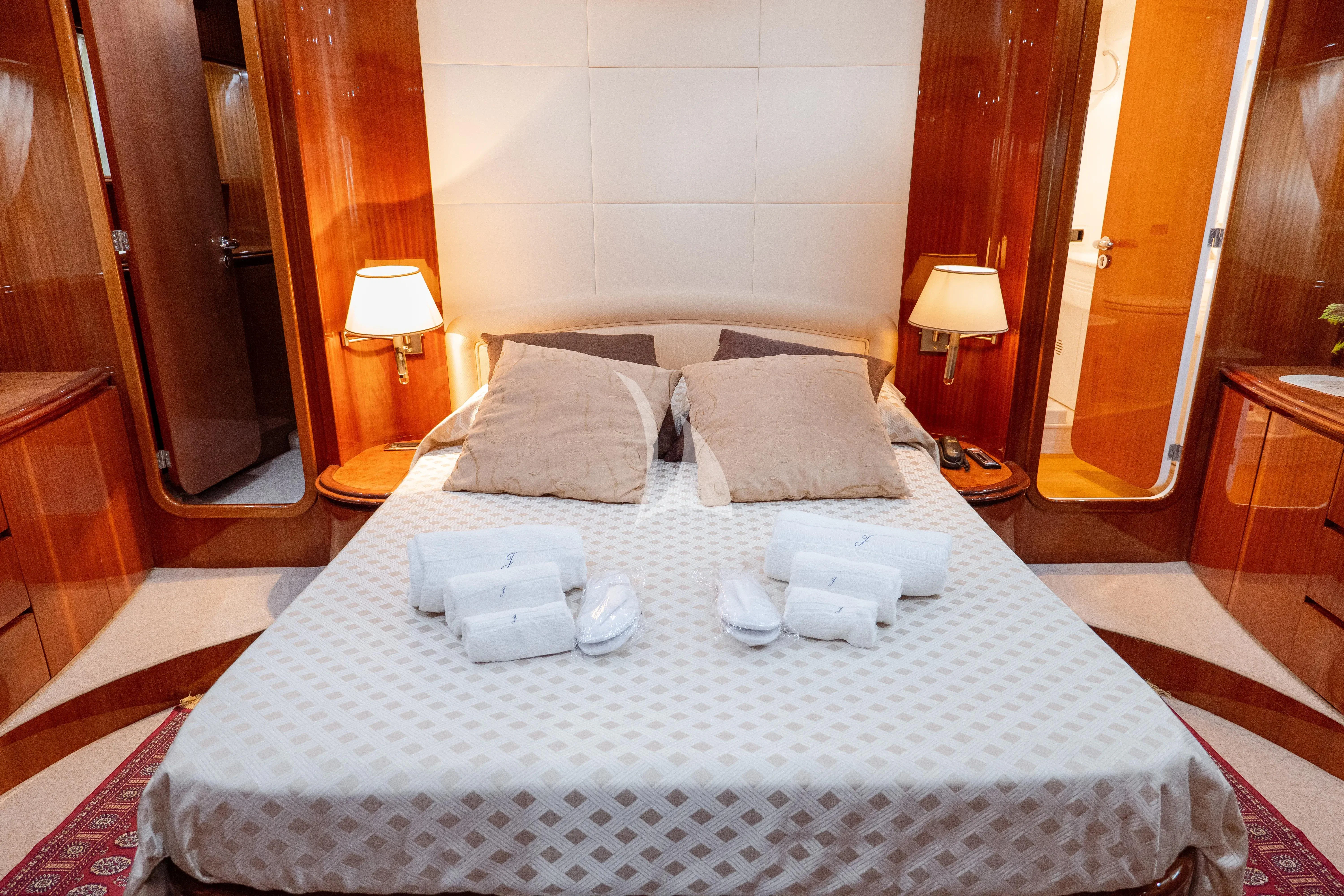 a hotel room with a bed aboard JAUNI Yacht for Sale