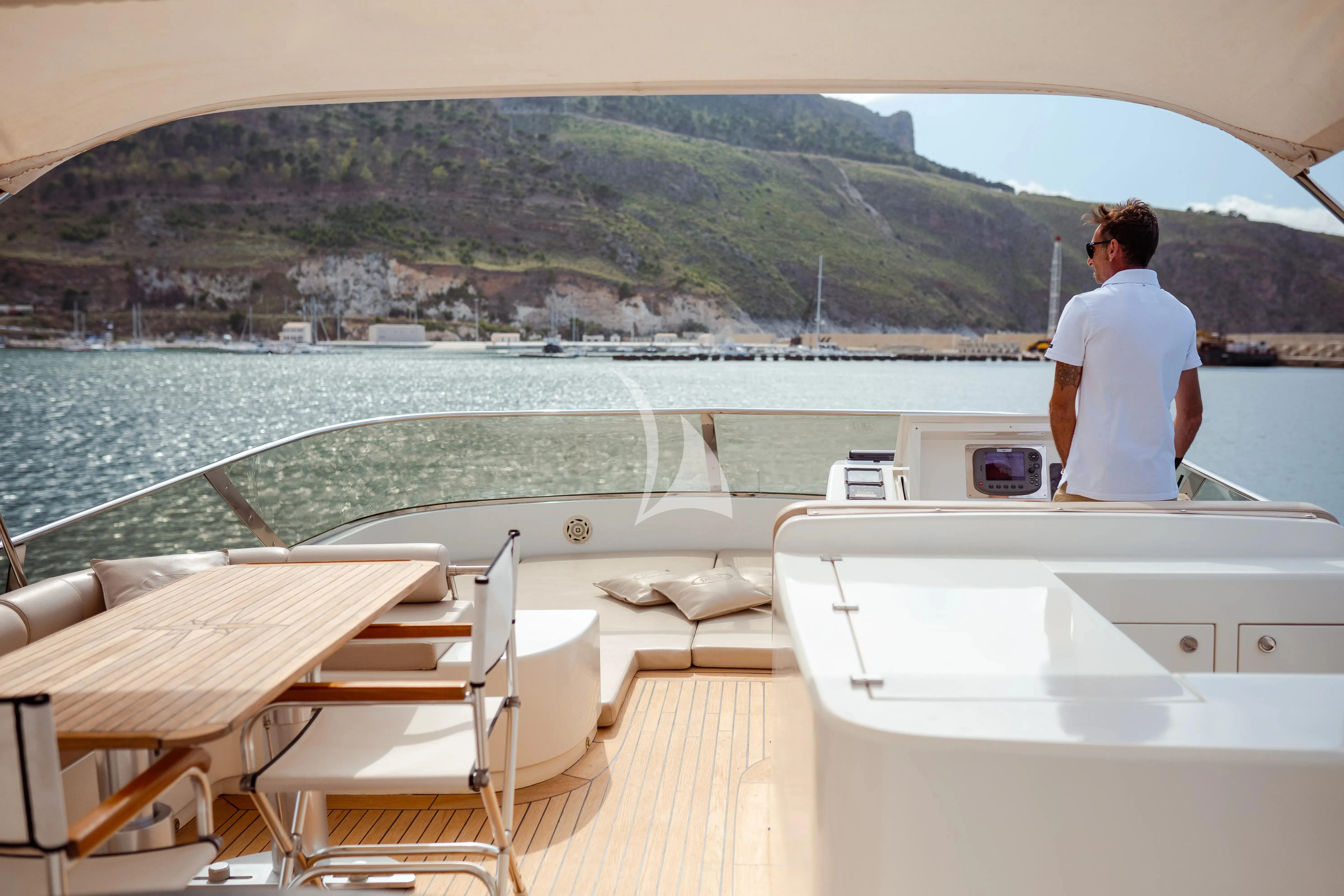 a person sitting on a boat aboard JAUNI Yacht for Sale
