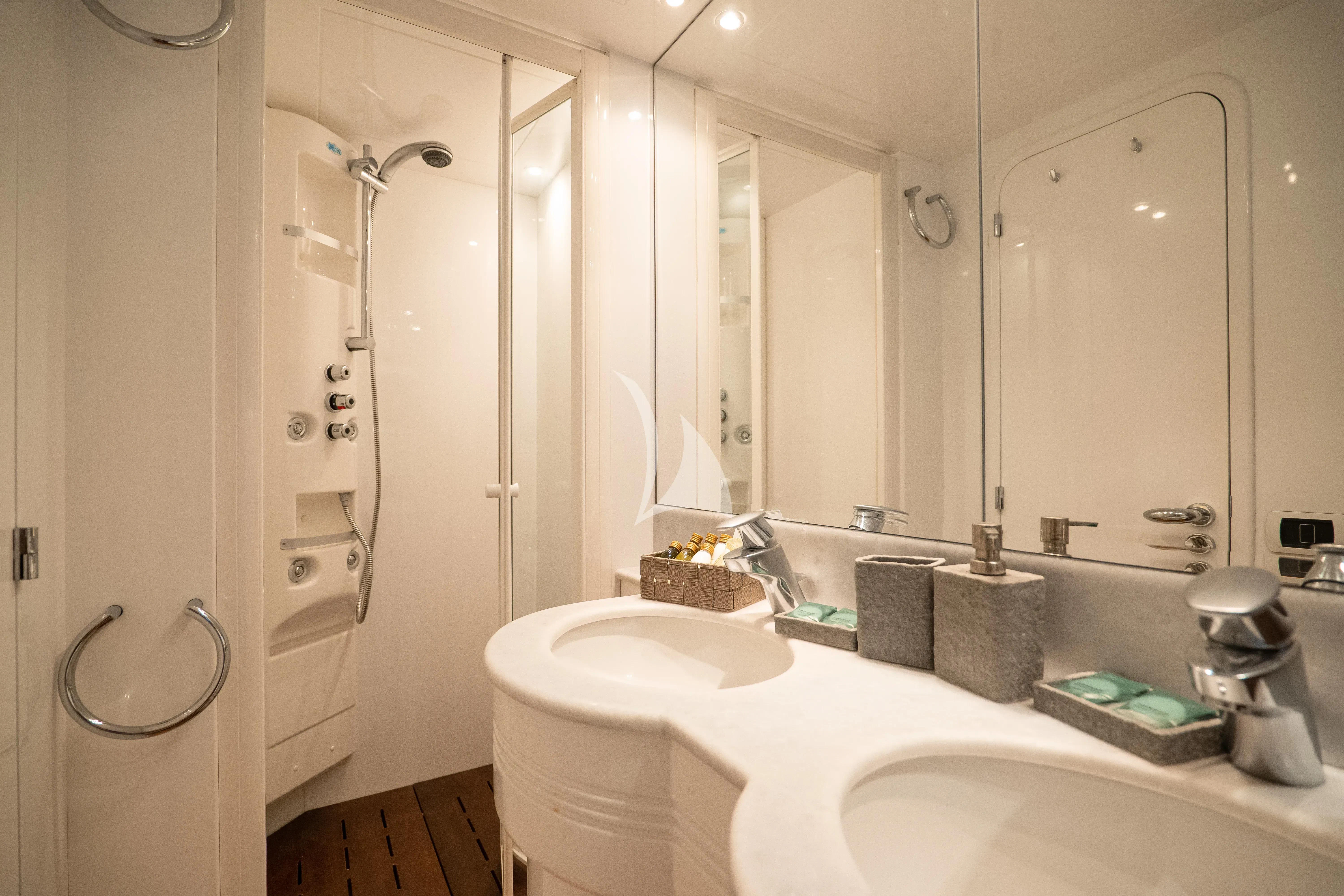 a bathroom with a shower and sink aboard JAUNI Yacht for Sale