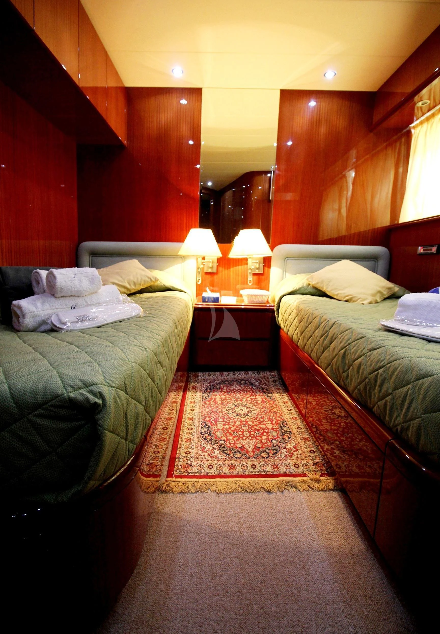 a room with two beds aboard JAUNI Yacht for Sale