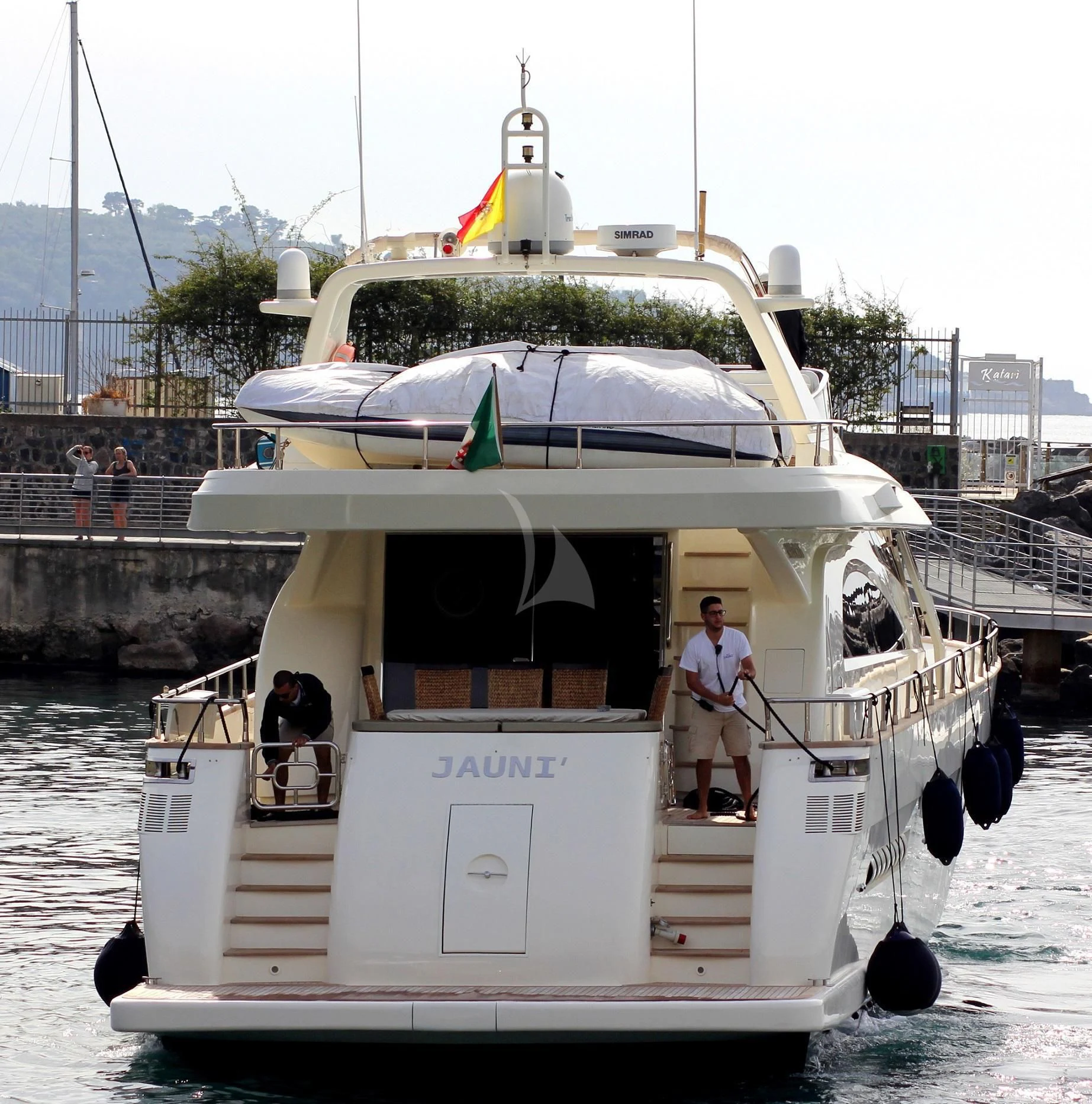 a boat with a person standing on it aboard JAUNI Yacht for Sale