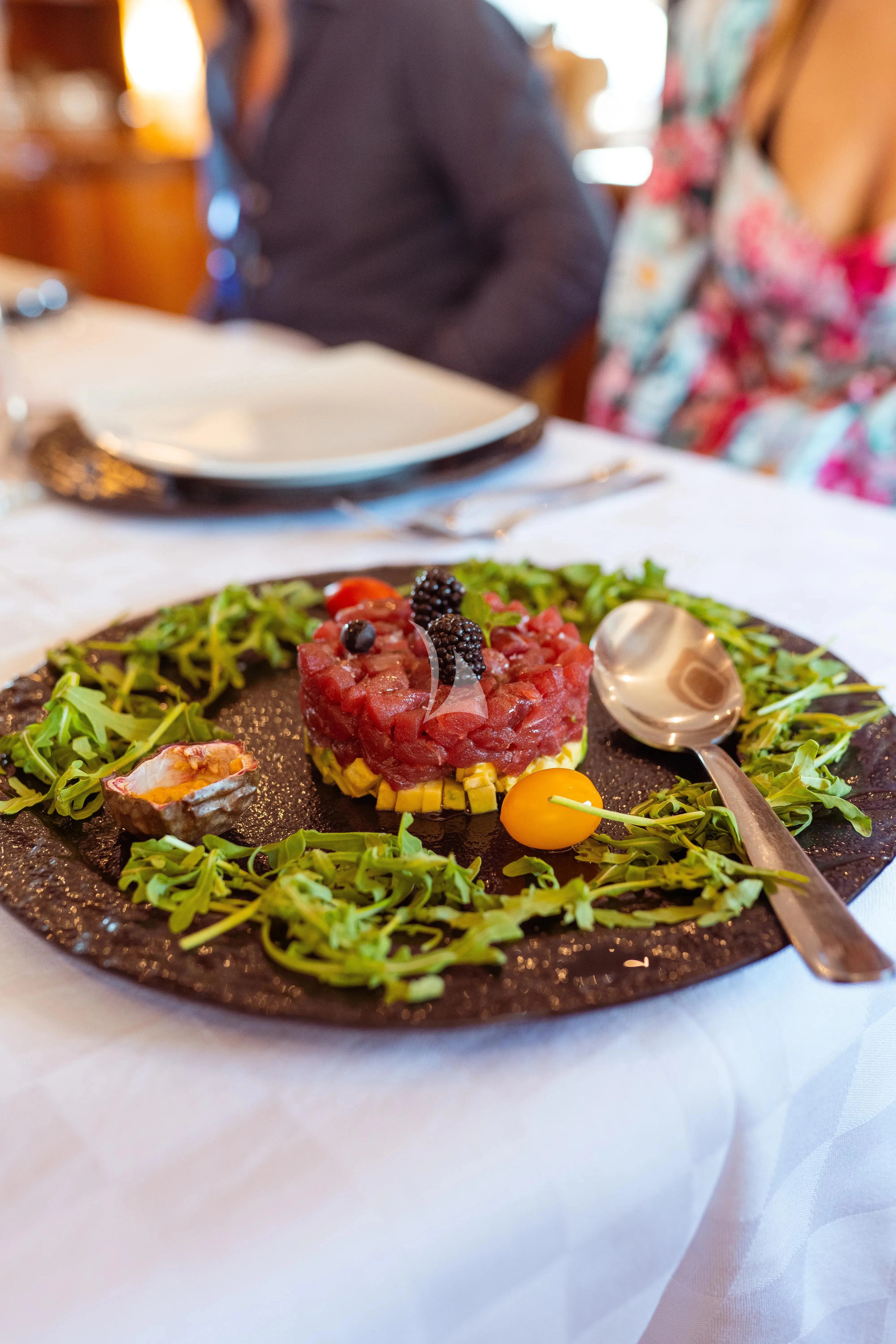 a plate of food aboard JAUNI Yacht for Sale