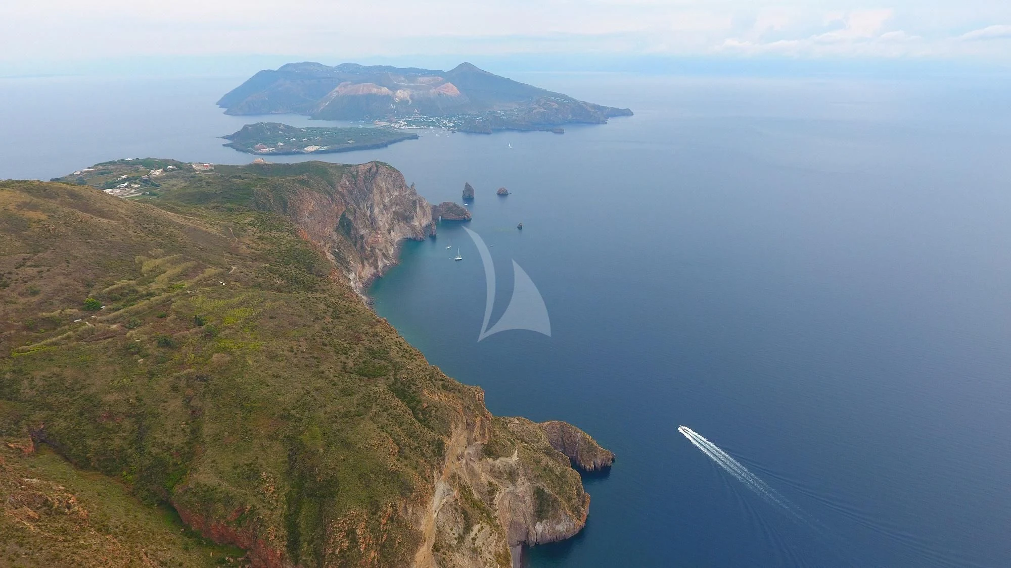 a body of water with land along it aboard JAUNI Yacht for Sale