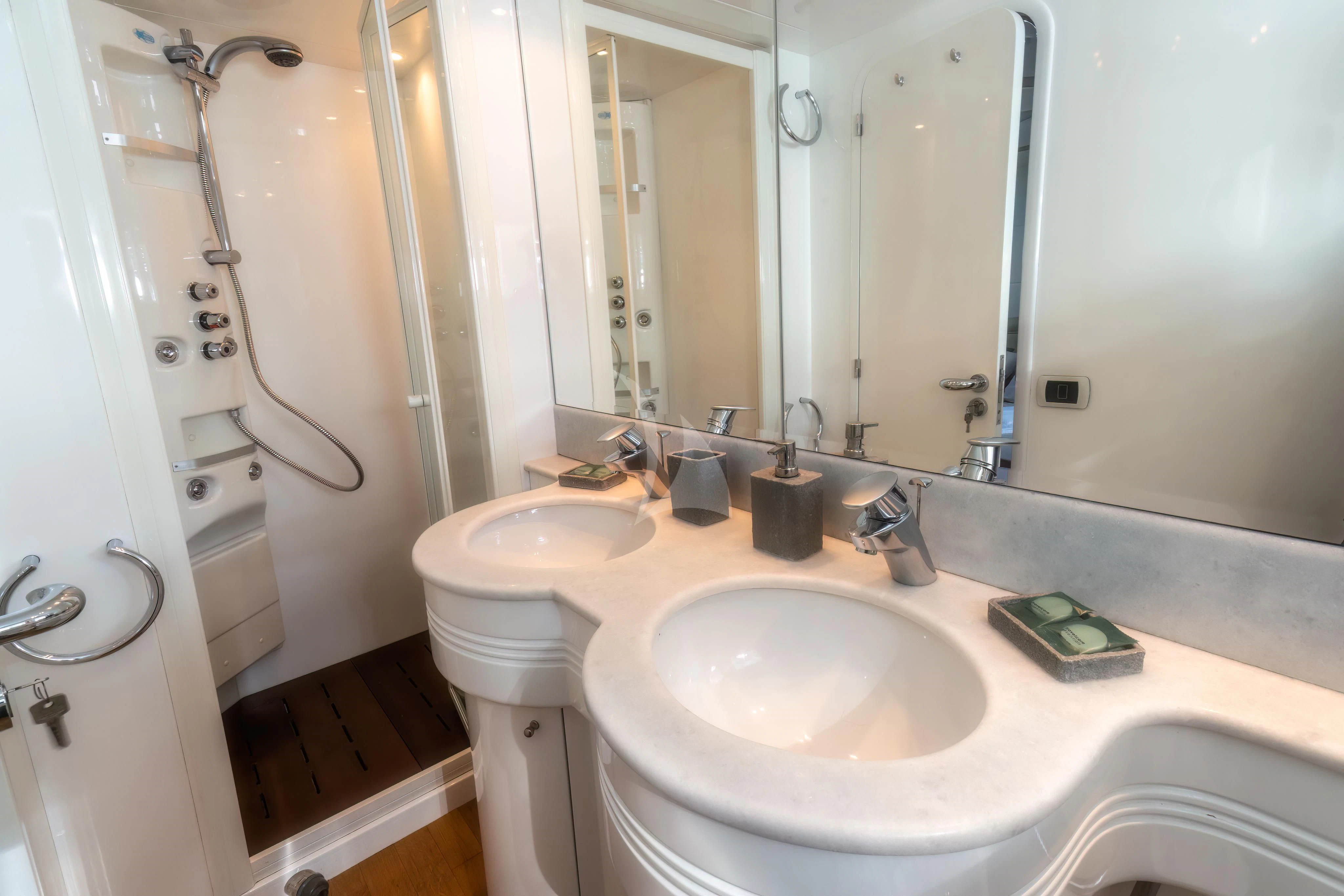 a bathroom with a sink and a shower aboard JAUNI Yacht for Sale