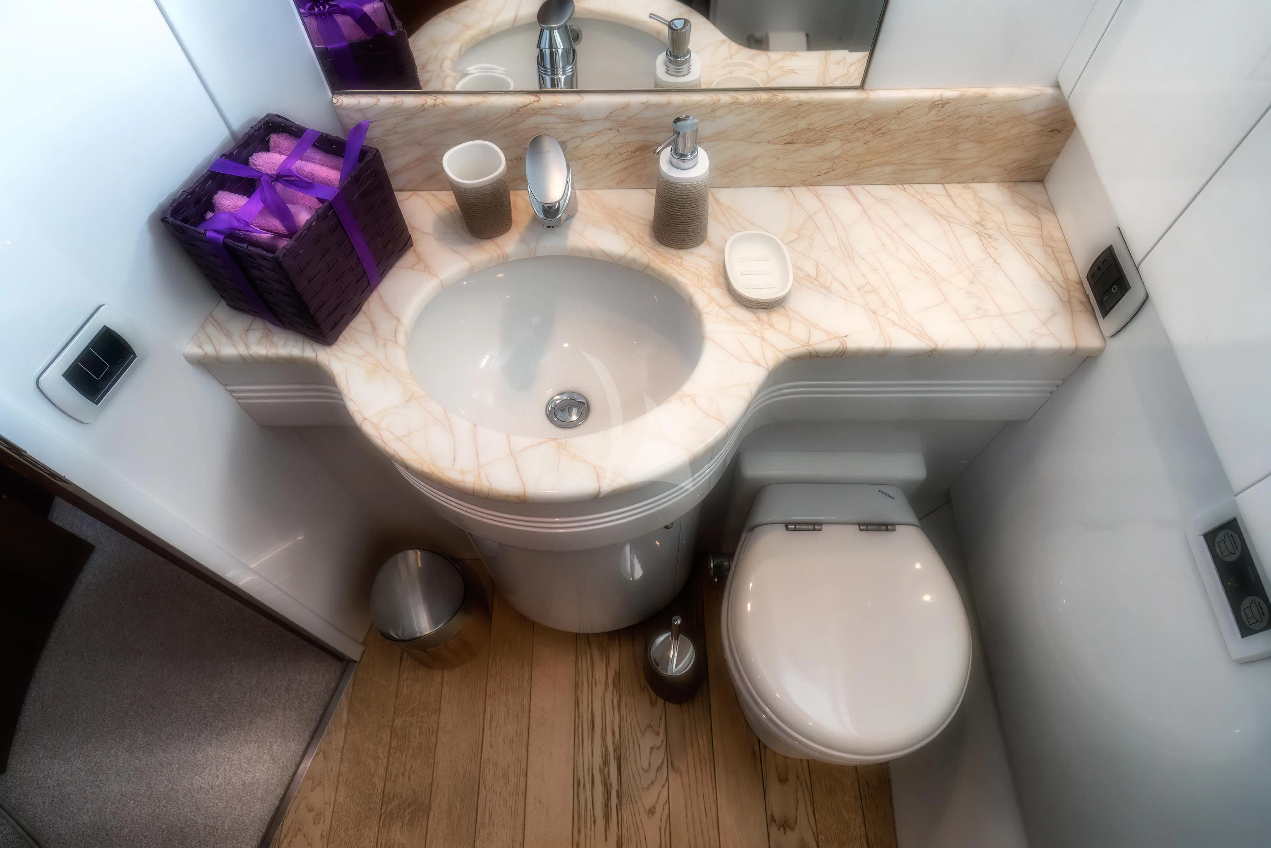 a sink and toilet in a bathroom aboard JAUNI Yacht for Sale