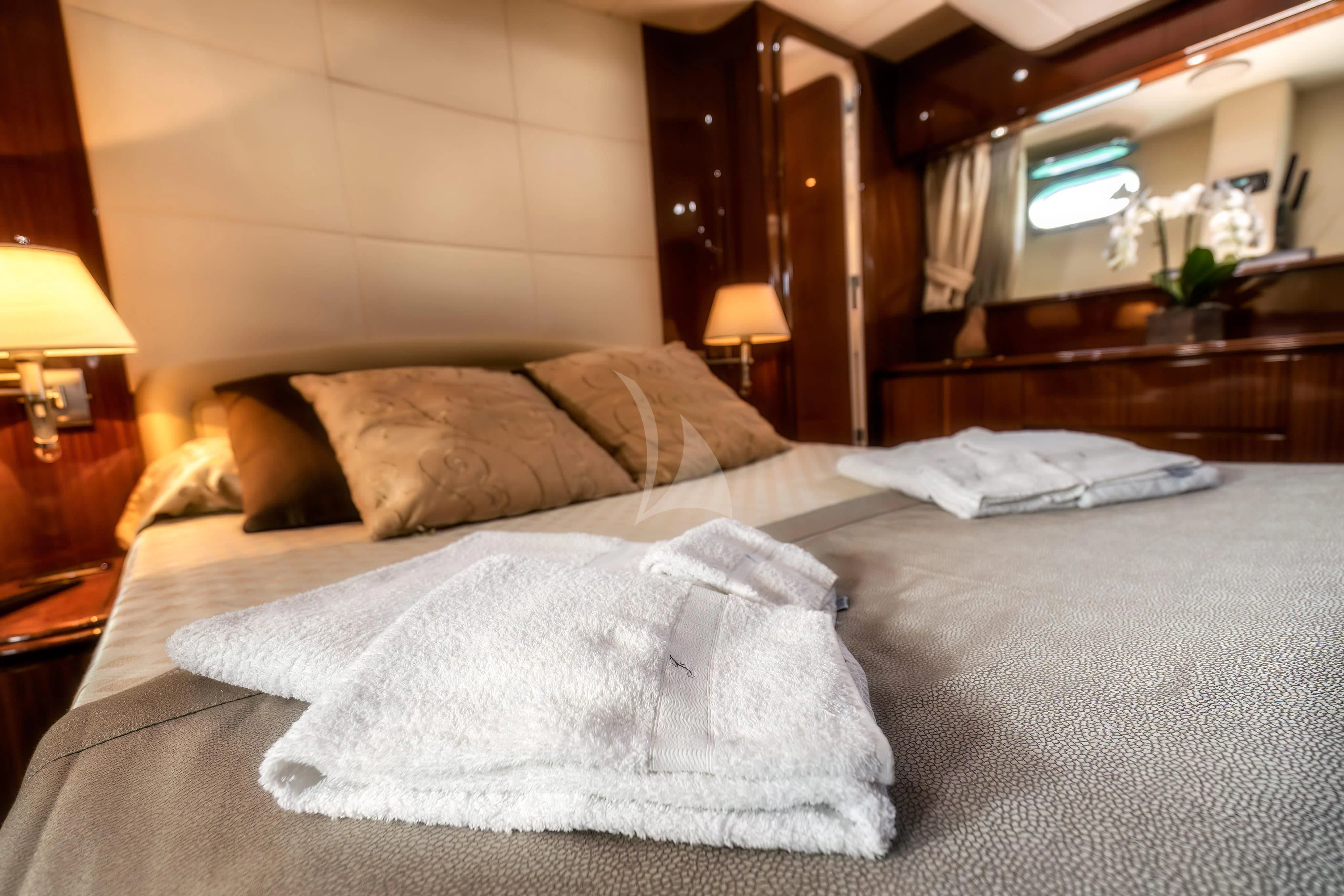 a bed with pillows aboard JAUNI Yacht for Sale