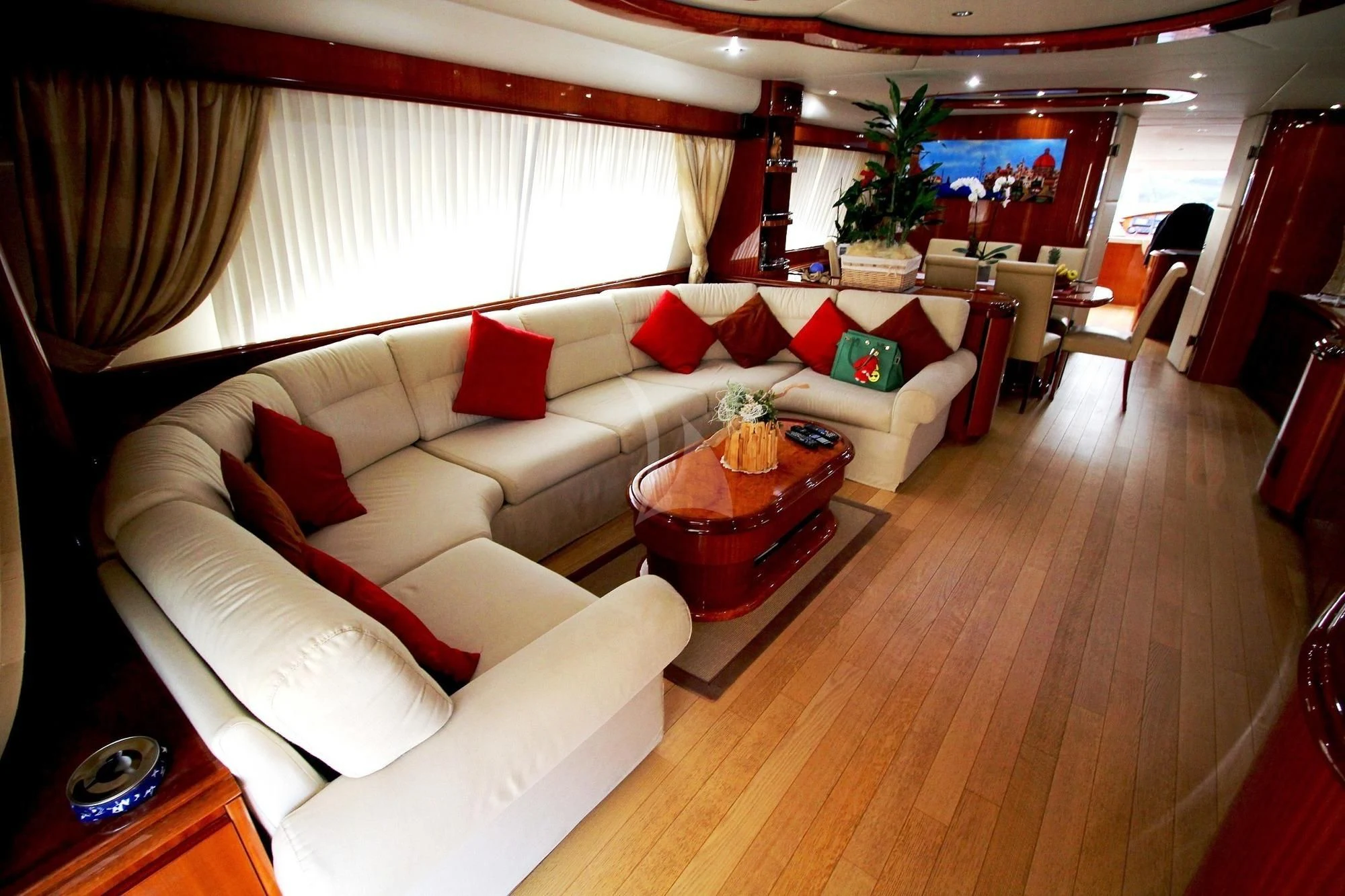 a living room with a couch and a table aboard JAUNI Yacht for Sale