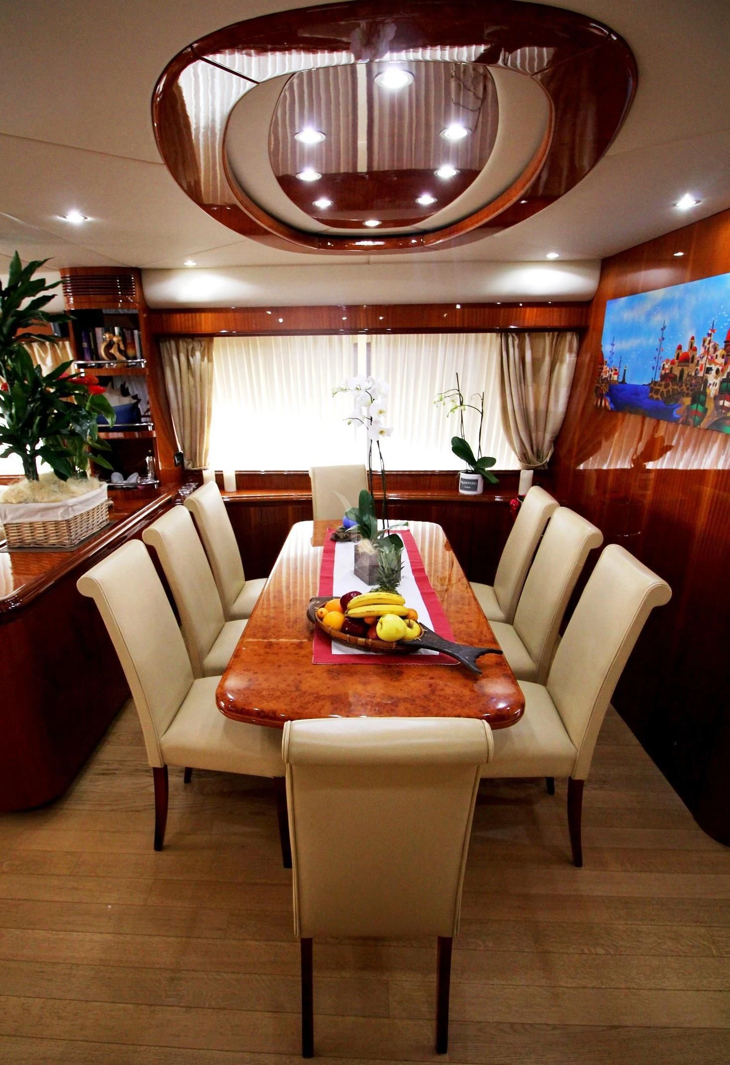 a dining room with a table and chairs aboard JAUNI Yacht for Sale