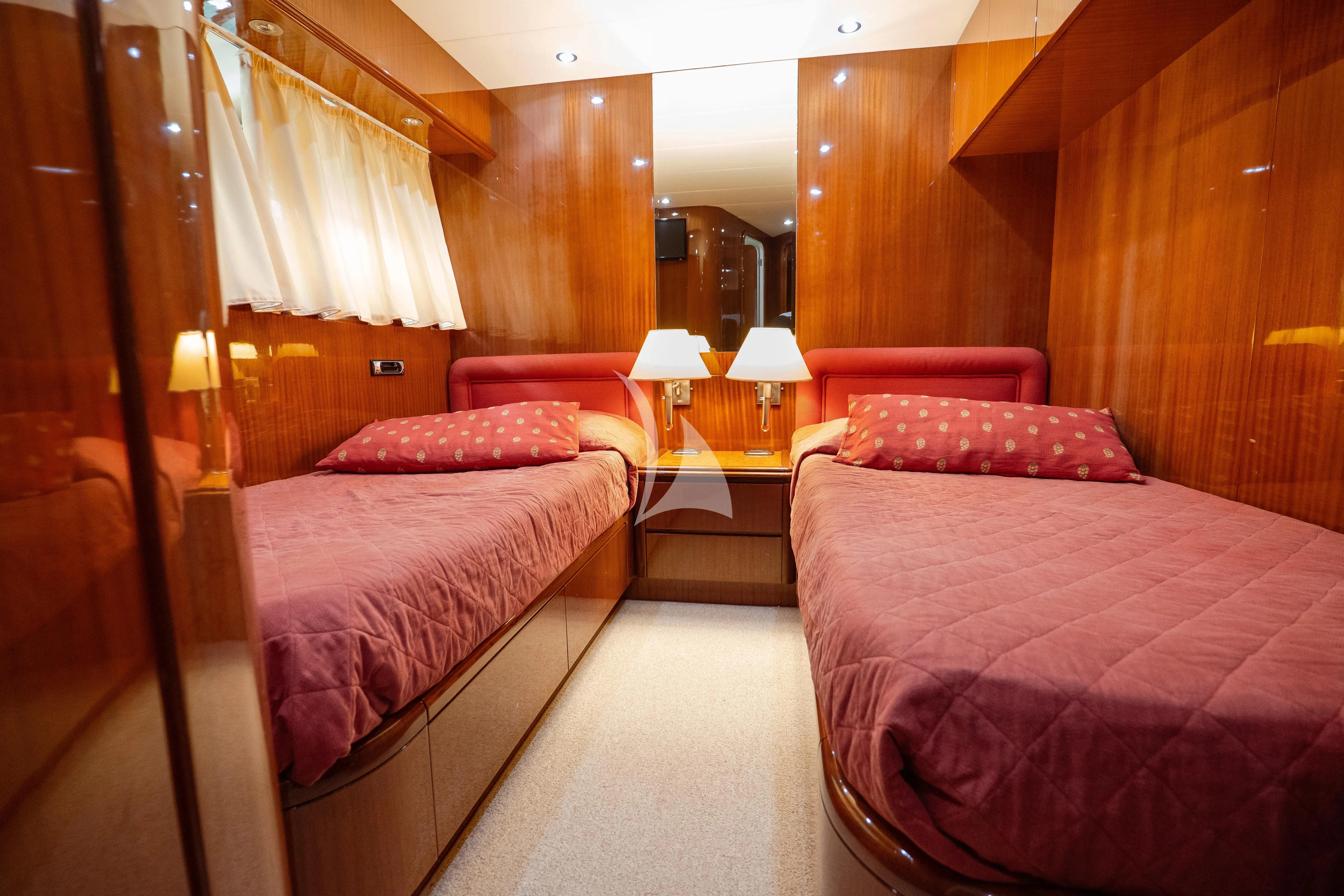 a couple of beds in a hotel room aboard JAUNI Yacht for Sale