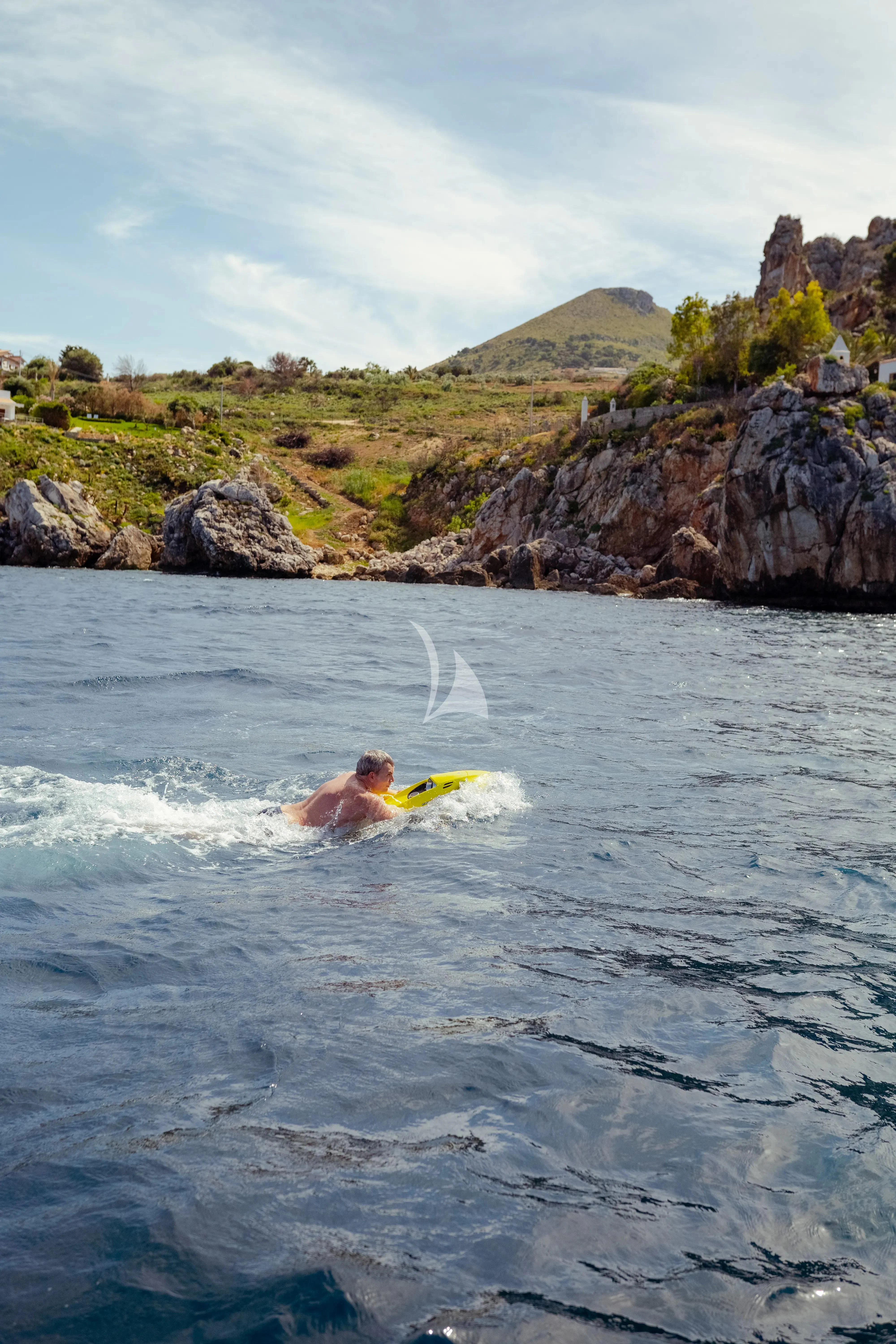 a man in the water aboard JAUNI Yacht for Sale