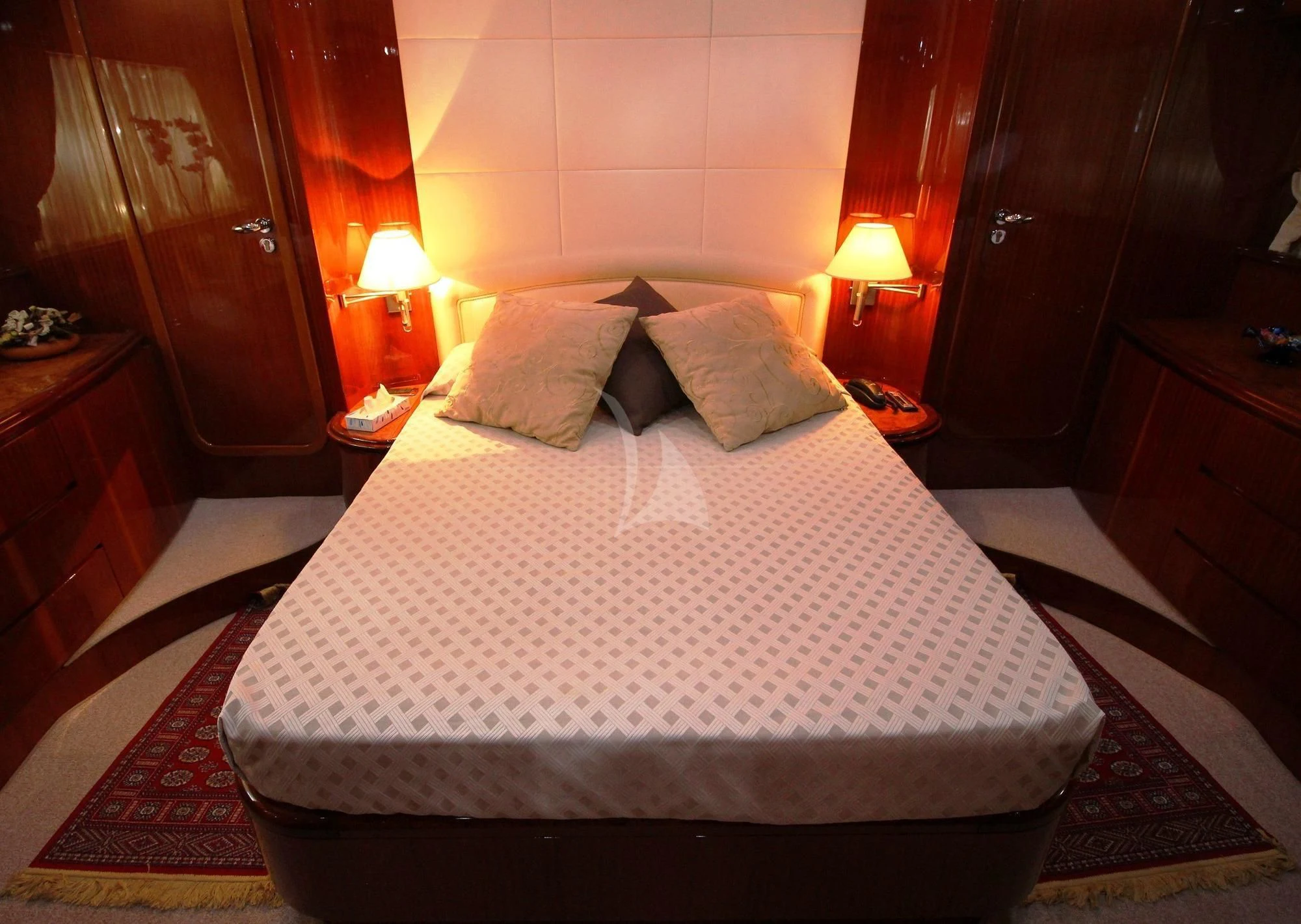 a bed with a white comforter aboard JAUNI Yacht for Sale