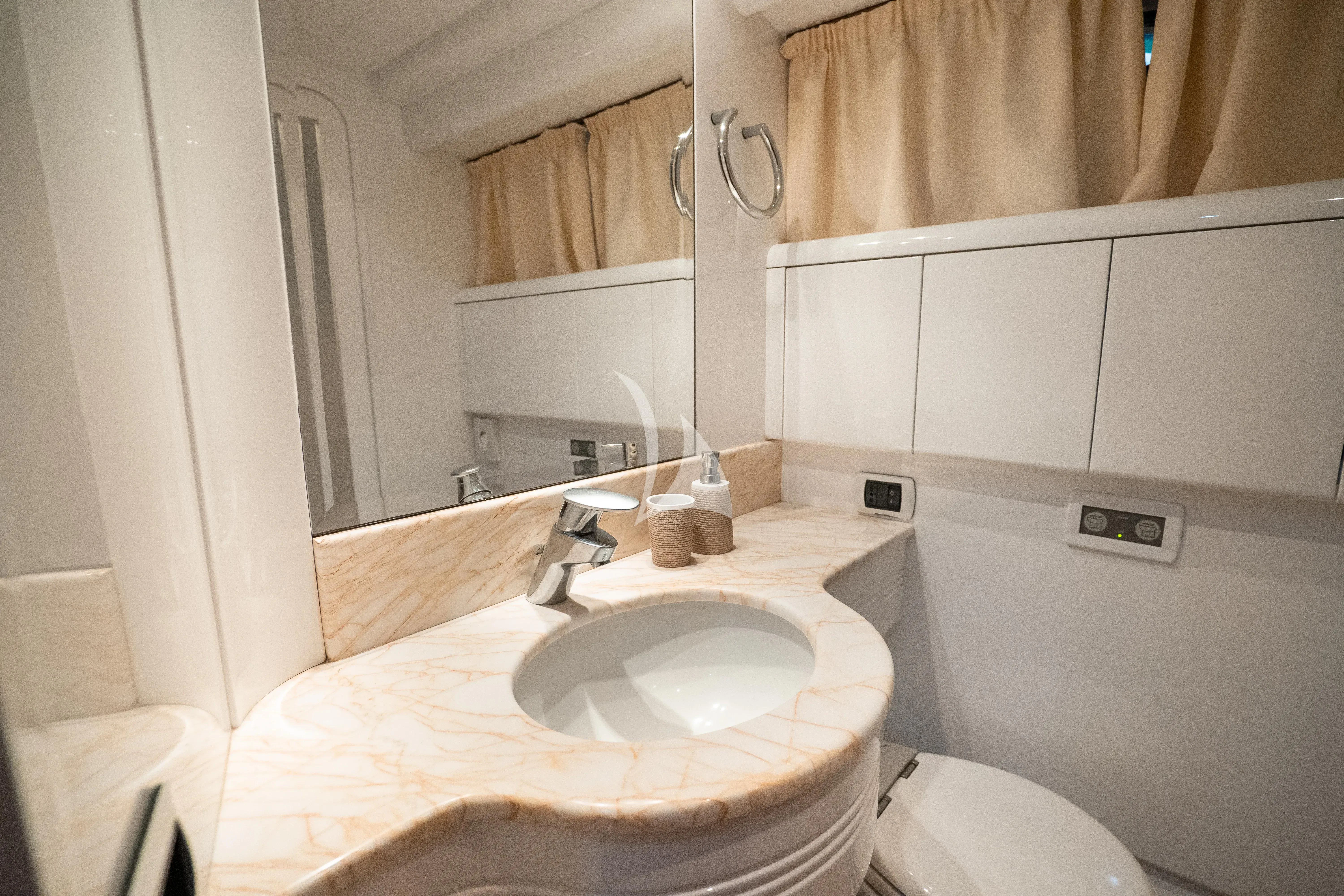 a bathroom with a sink and a toilet aboard JAUNI Yacht for Sale