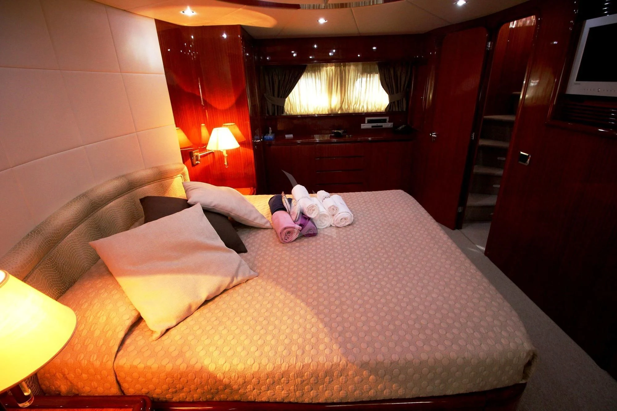 a bed with a pink blanket aboard JAUNI Yacht for Sale