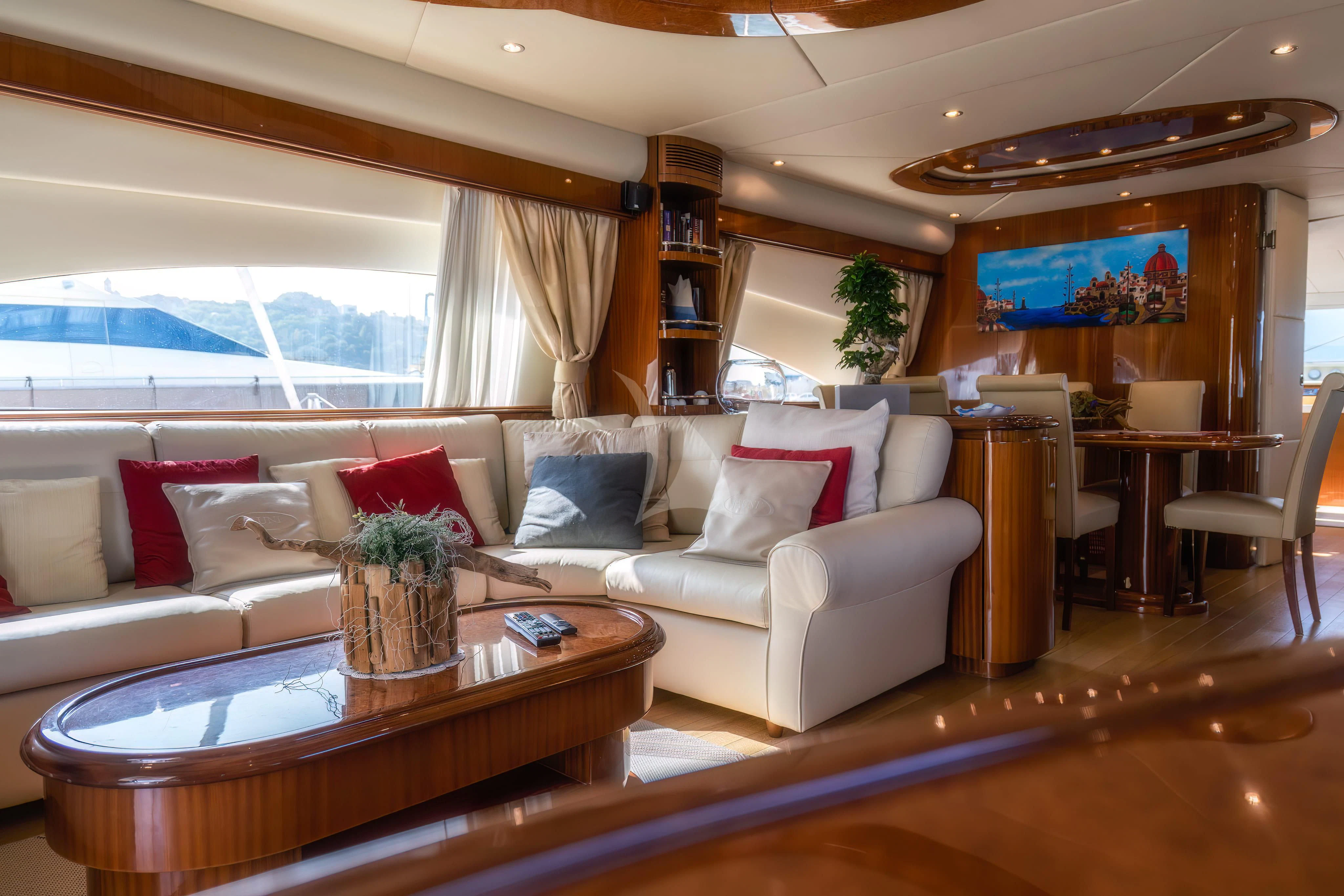 a living room with a couch and a table aboard JAUNI Yacht for Sale