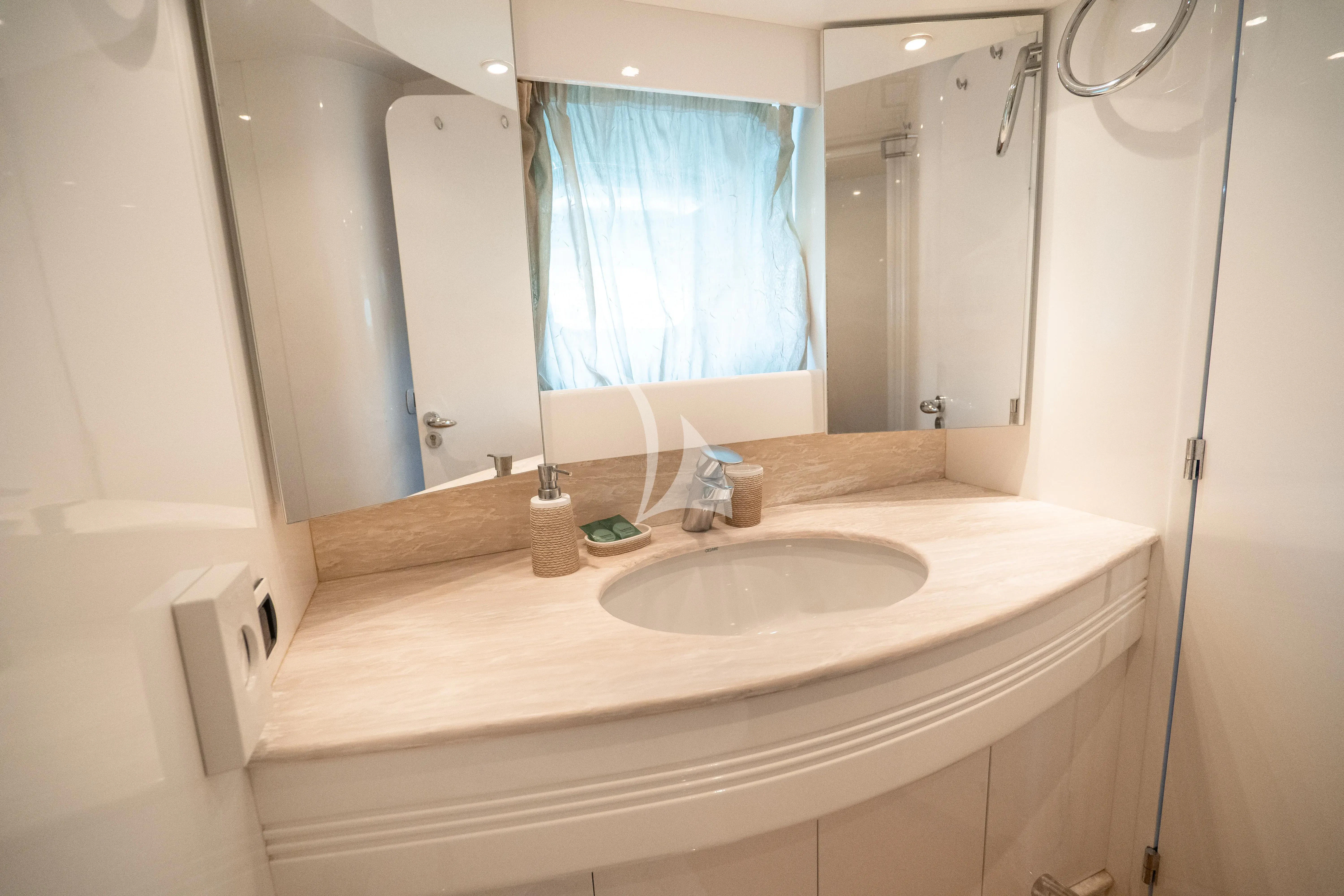 a bathroom with a sink and a mirror aboard JAUNI Yacht for Sale