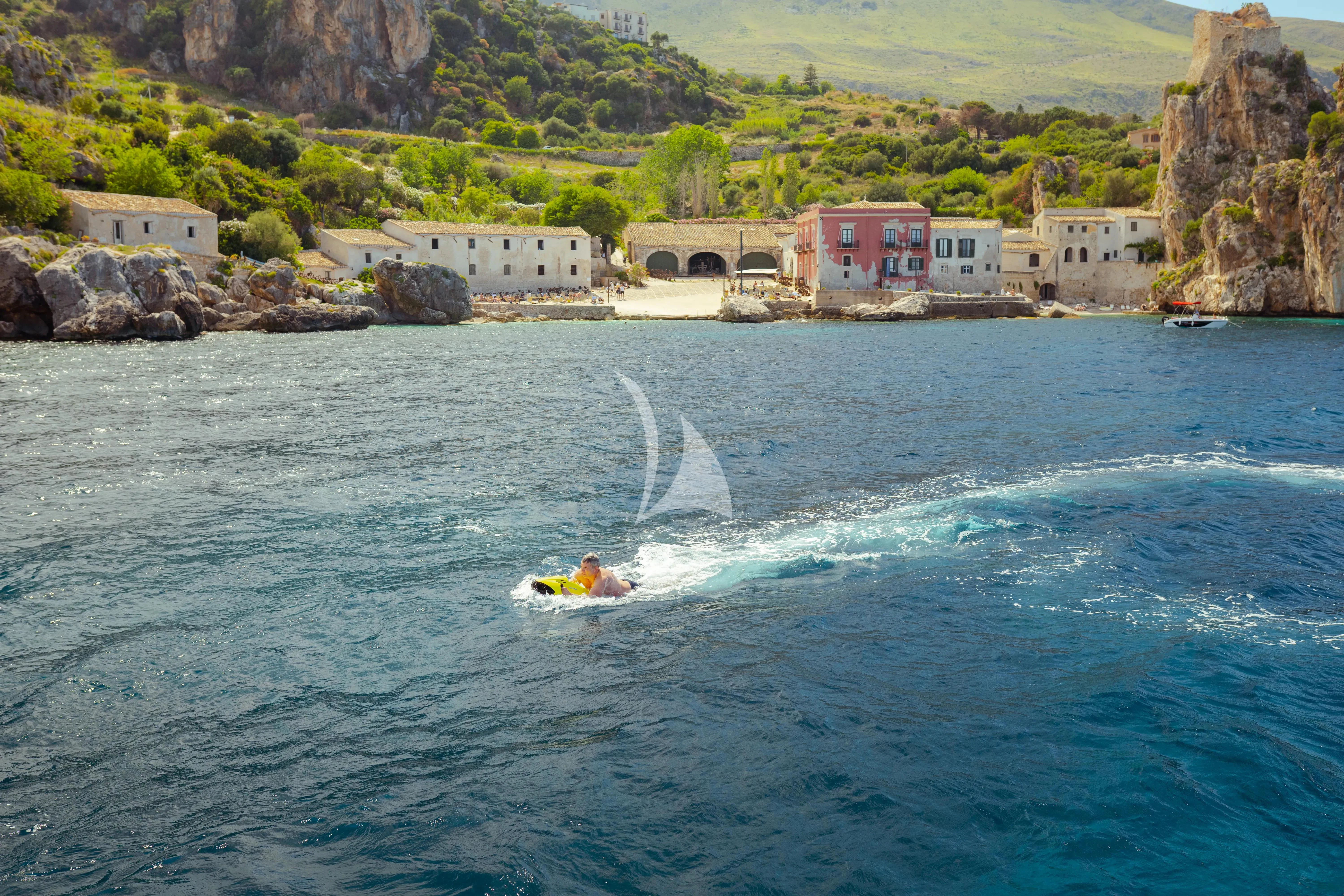 a person on a jet ski aboard JAUNI Yacht for Sale
