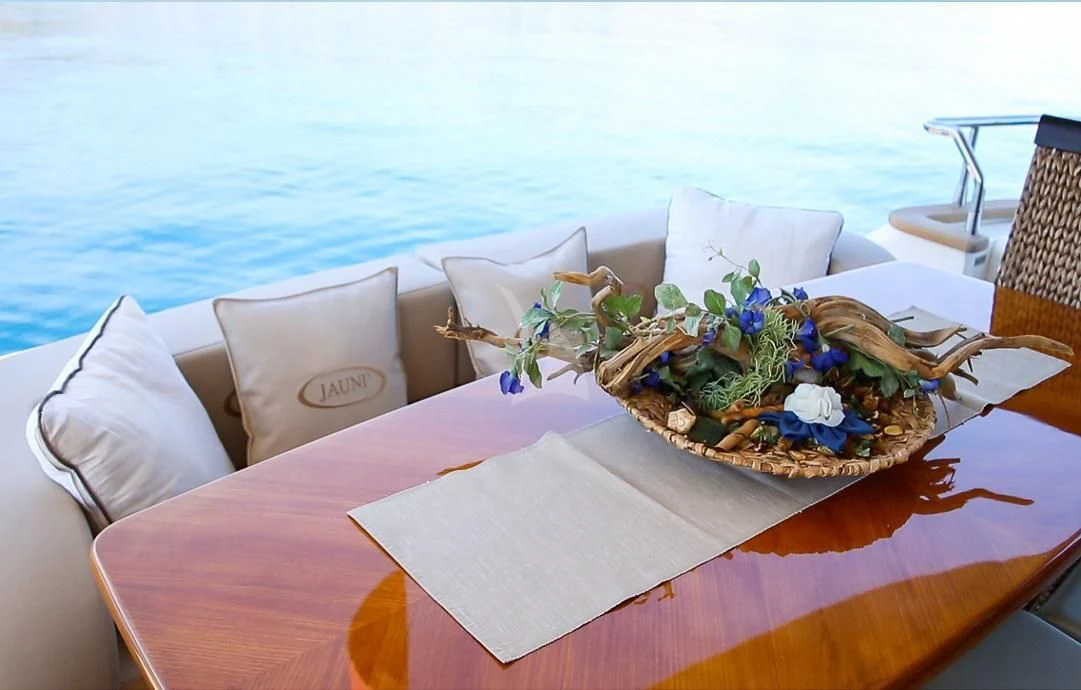 a plate of food on a table aboard JAUNI Yacht for Sale