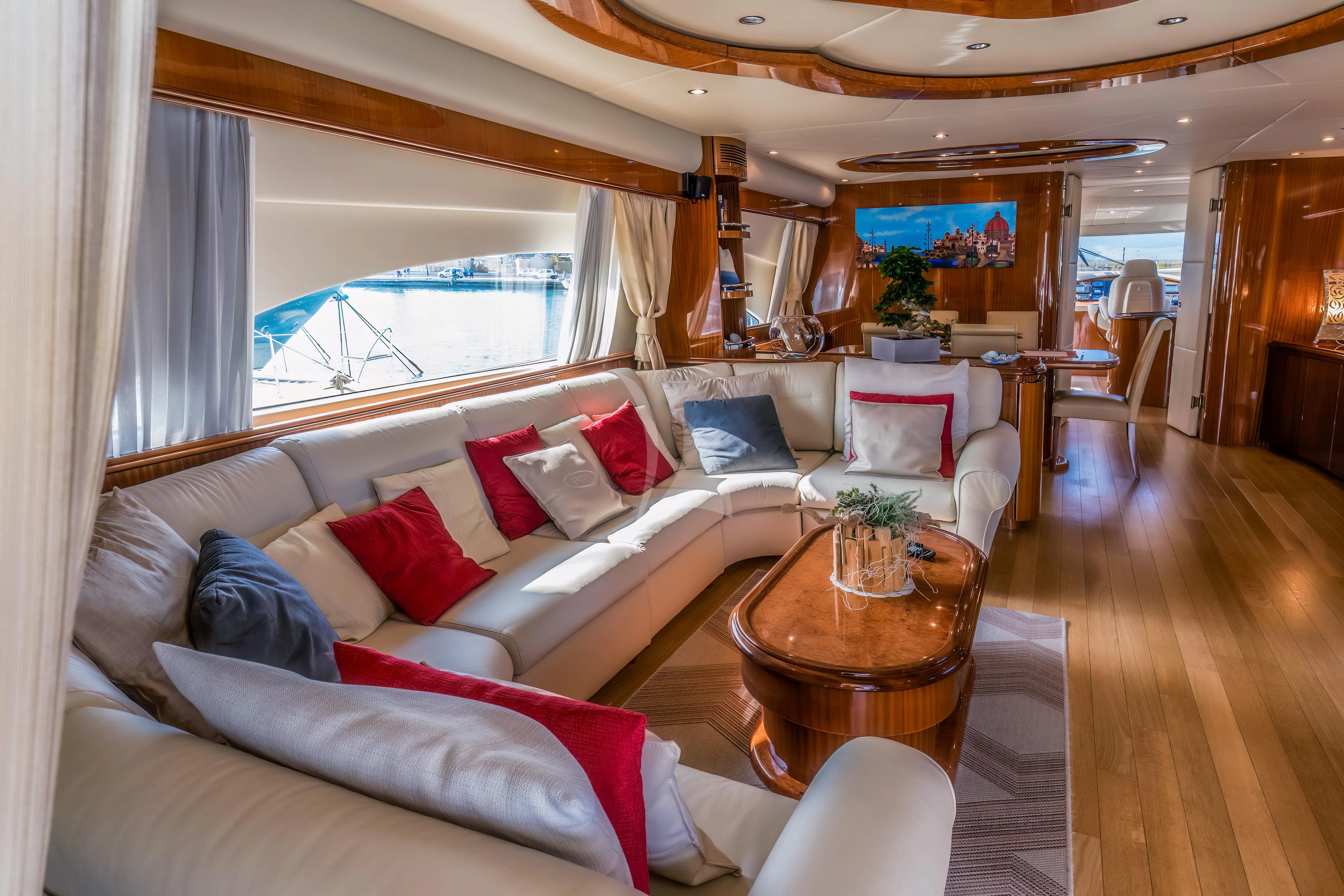 a living room with a couch and a table aboard JAUNI Yacht for Sale