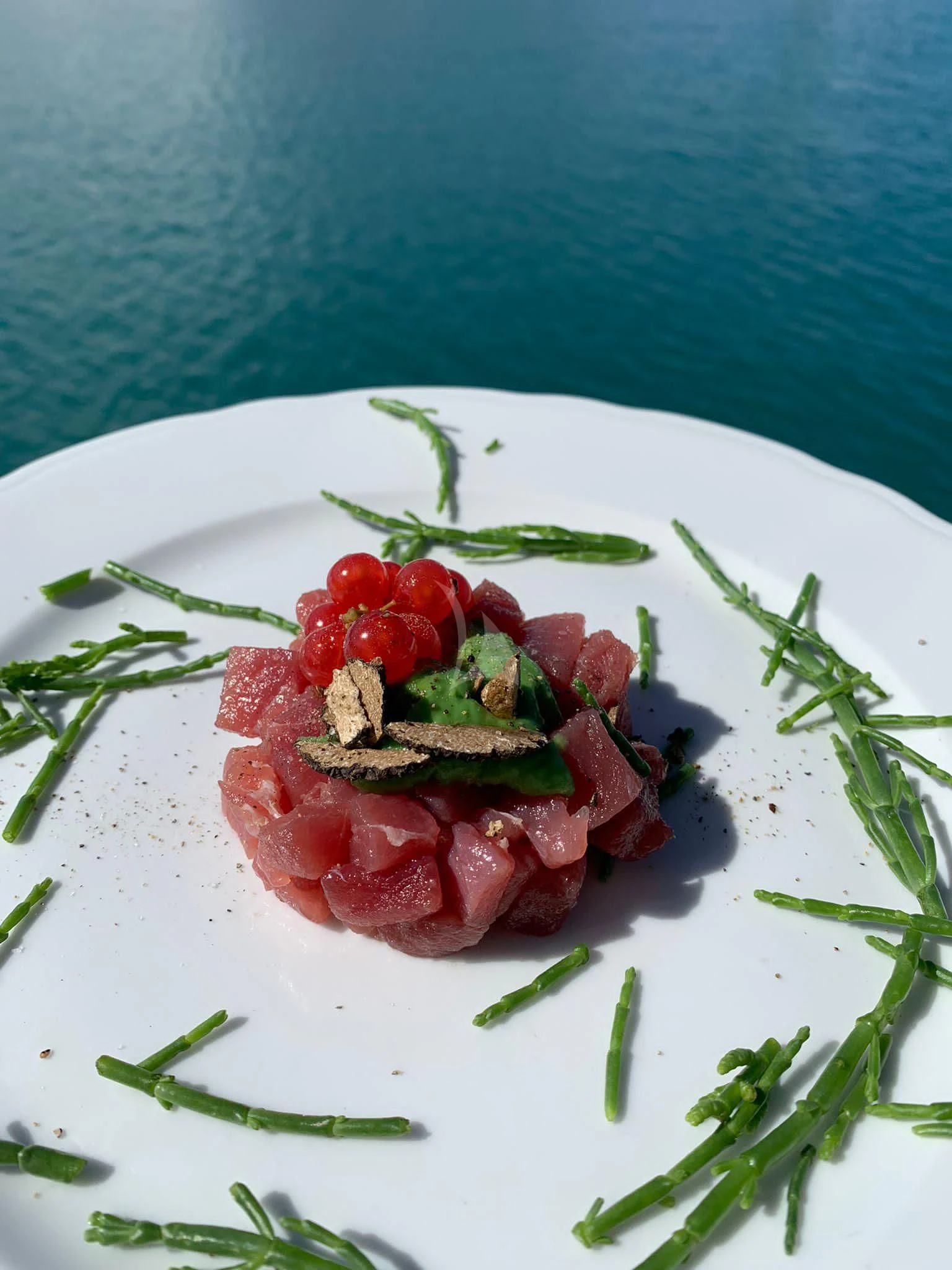 a plate of food aboard JAUNI Yacht for Sale