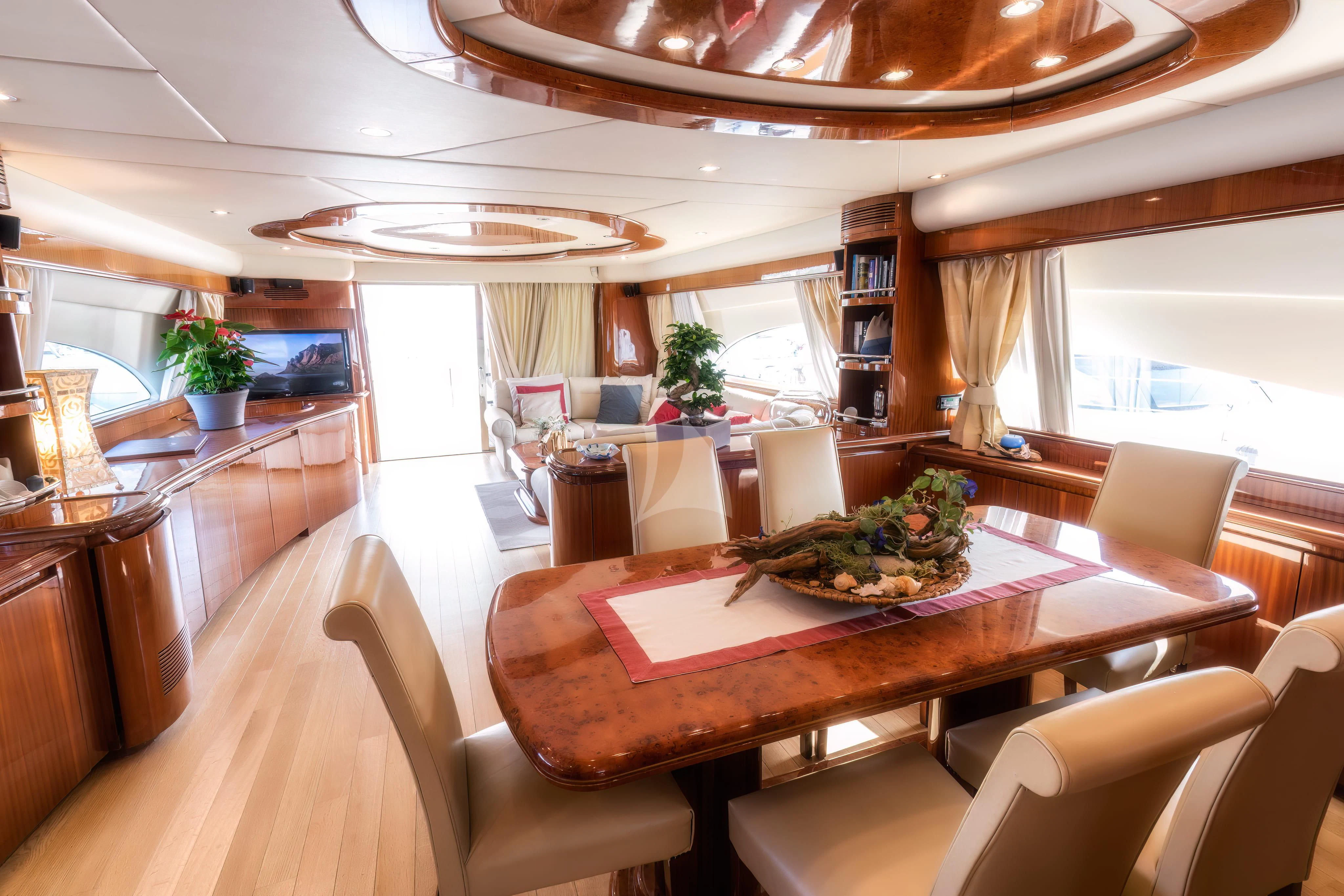 a large kitchen with a dining table aboard JAUNI Yacht for Sale