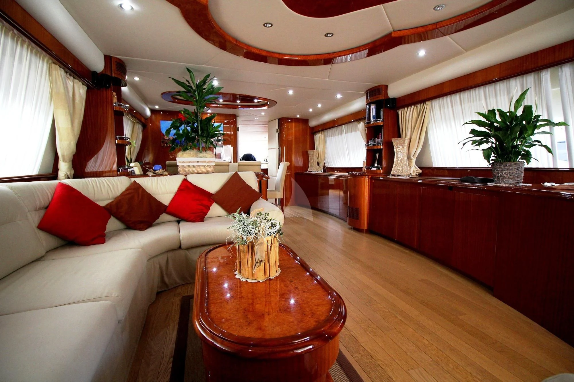 a living room with a large table aboard JAUNI Yacht for Sale