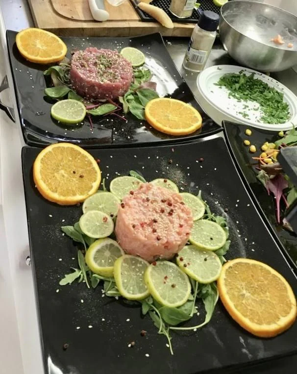 a pan of meat and vegetables aboard JAUNI Yacht for Sale