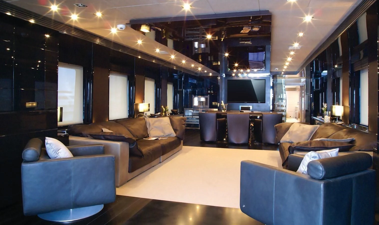 a living room with a large couch aboard RL NOOR Yacht for Sale